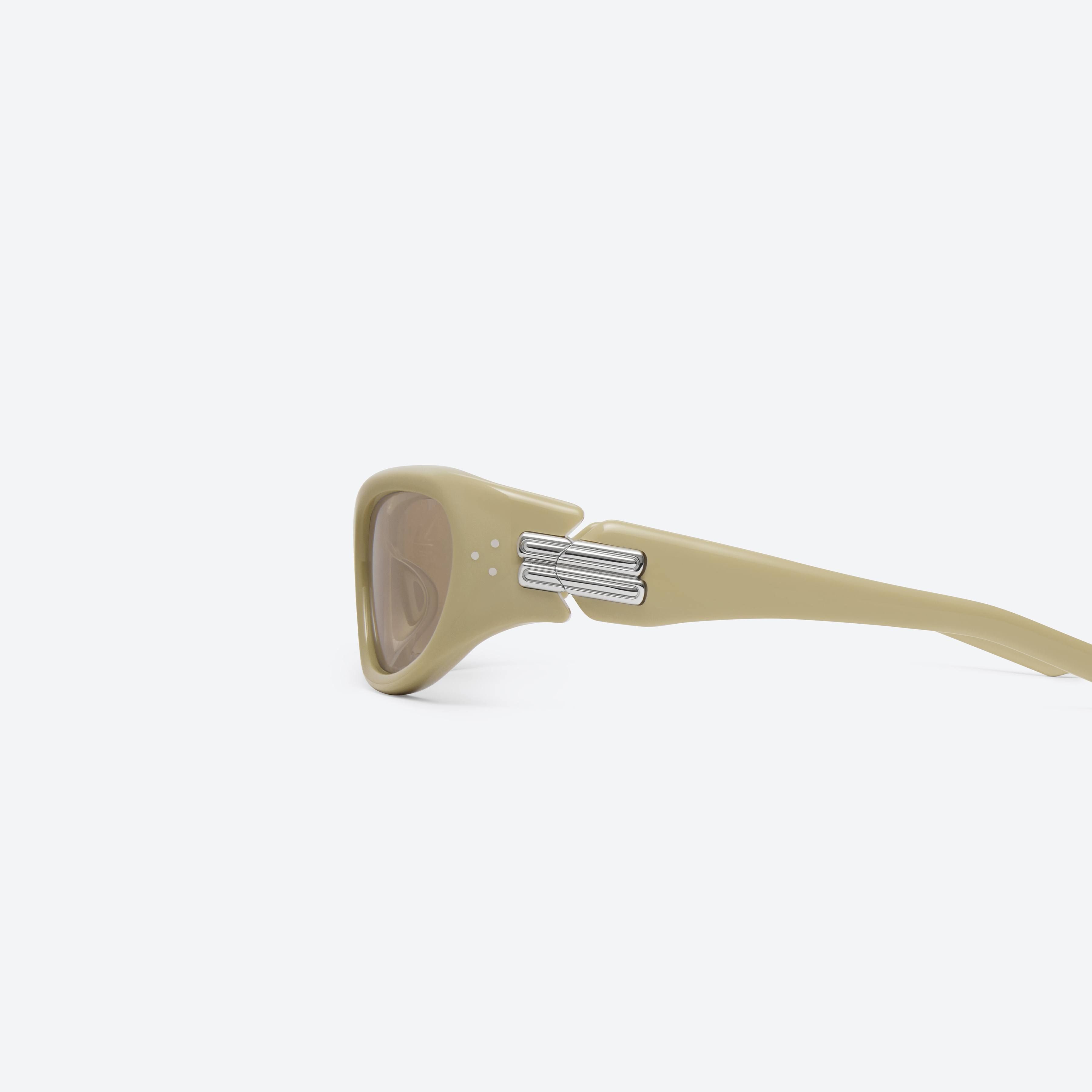 A detailed left view of Gentle Monster Memento Y10 Yellow Mixed framed Wraparound sunglasses.