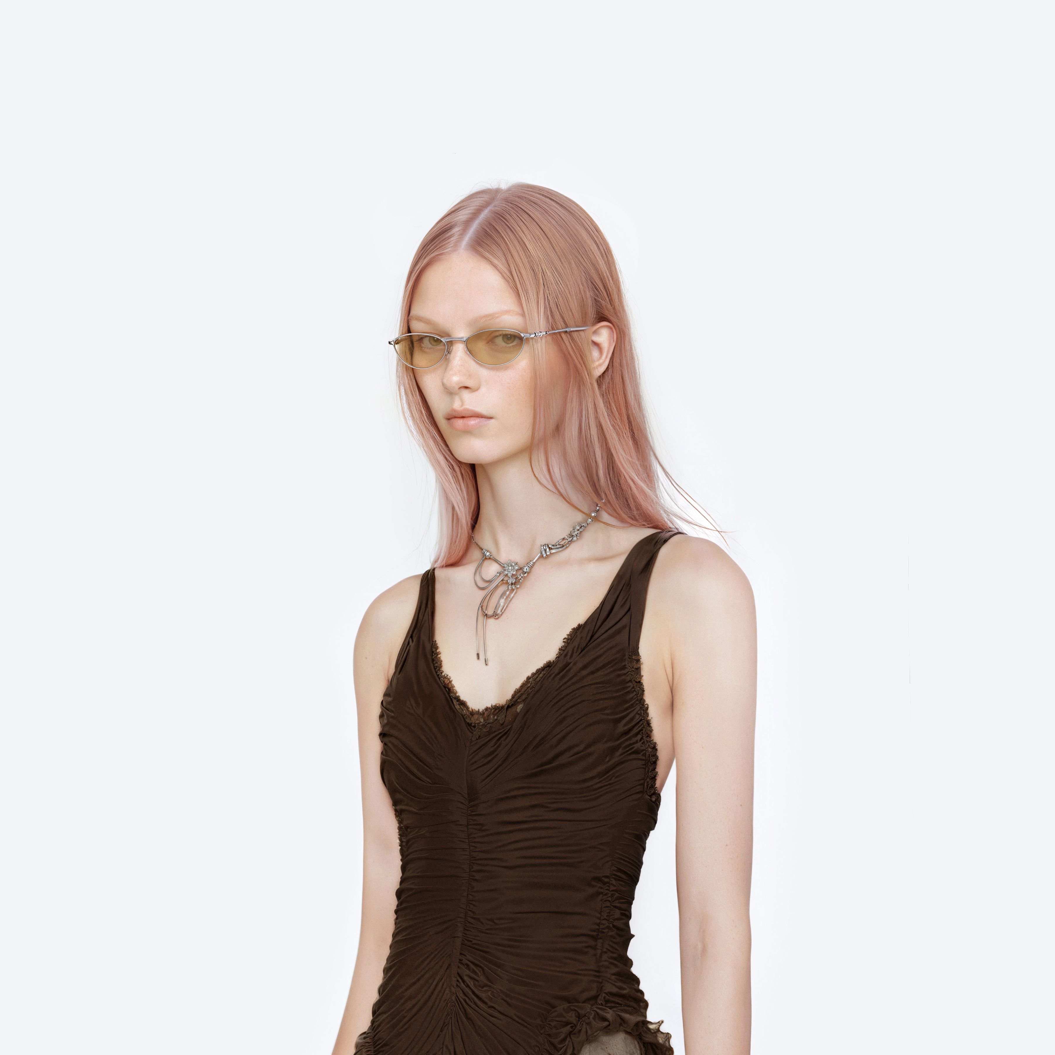 Model wearing the Cubit 02(Y) Silver Metal framed Oval glasses.