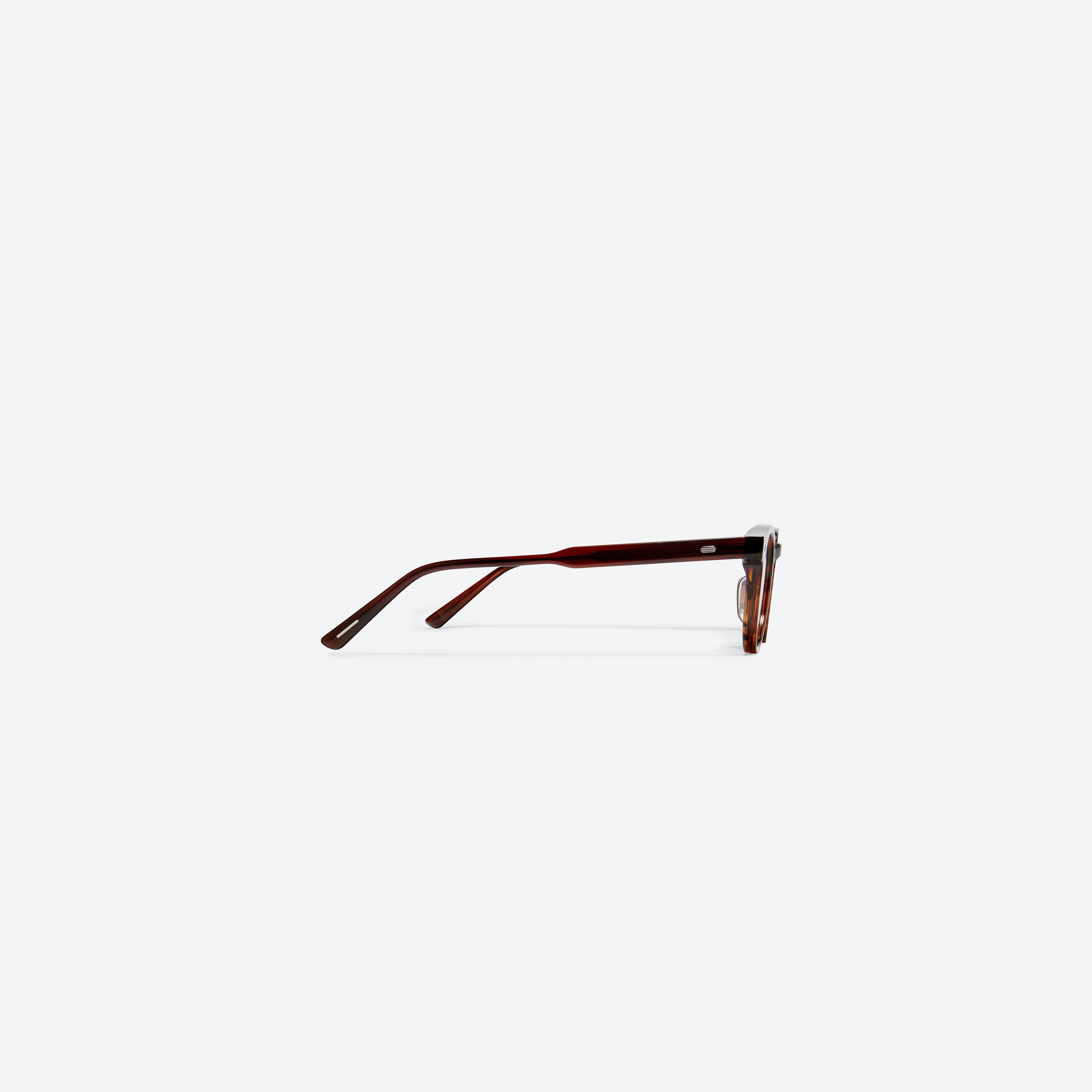 A detailed right view of Gentle Monster Milan A B4 Brown Acetate framed Round glasses.