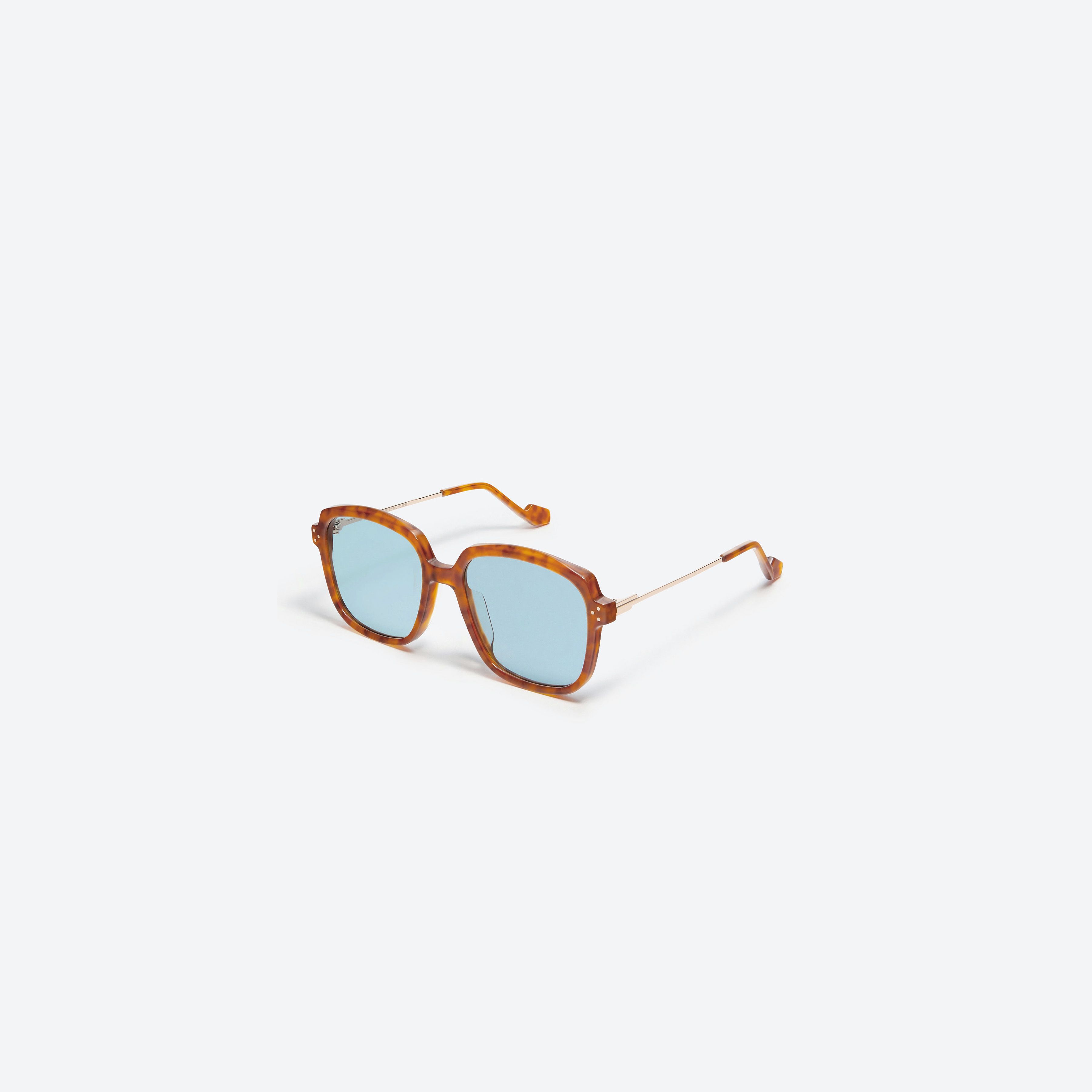 45-degree view of Gentle Monster Millie L1 Tortoise Mixed framed Square sunglasses.