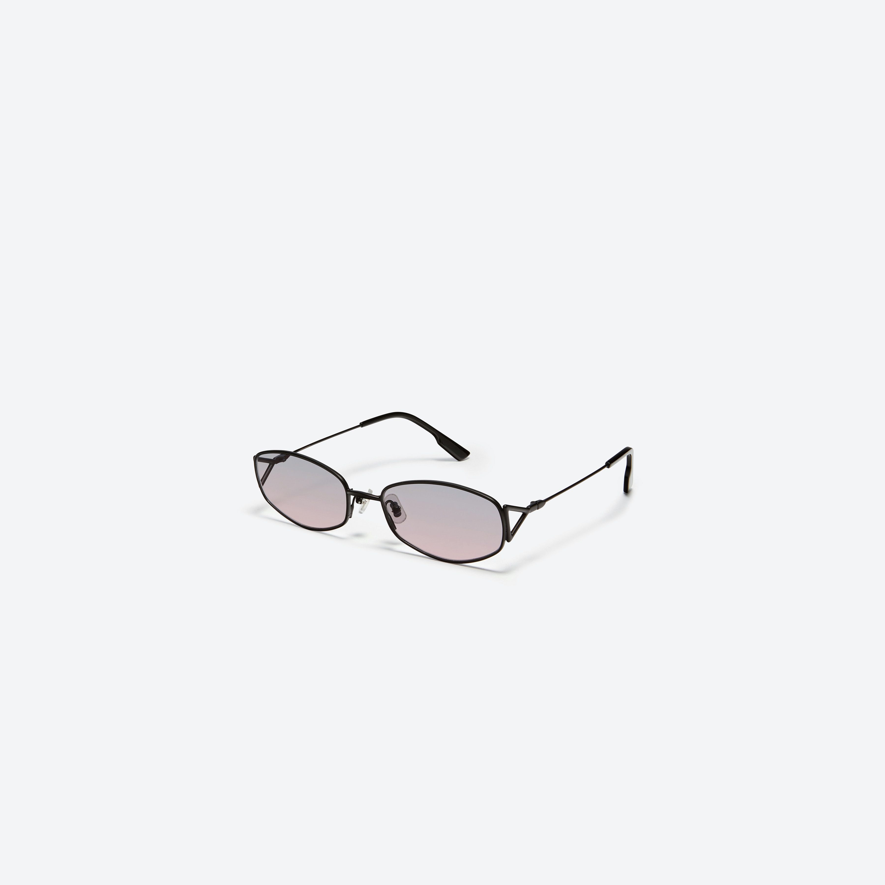 45-degree view of Gentle Monster Moneta M01 Black Metal framed Oval sunglasses.