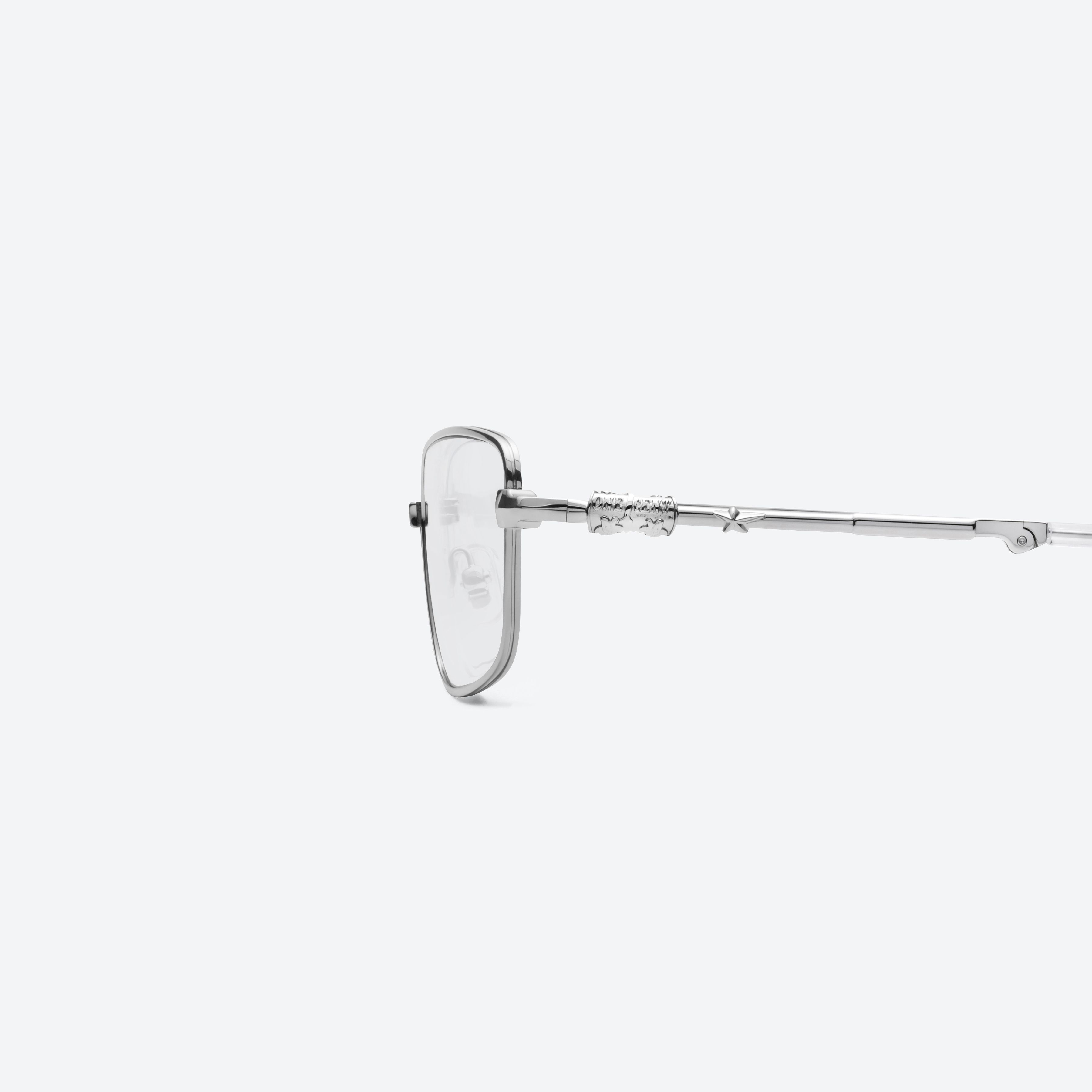 A detailed left view of Gentle Monster TARX 02 Silver Metal framed Square glasses.