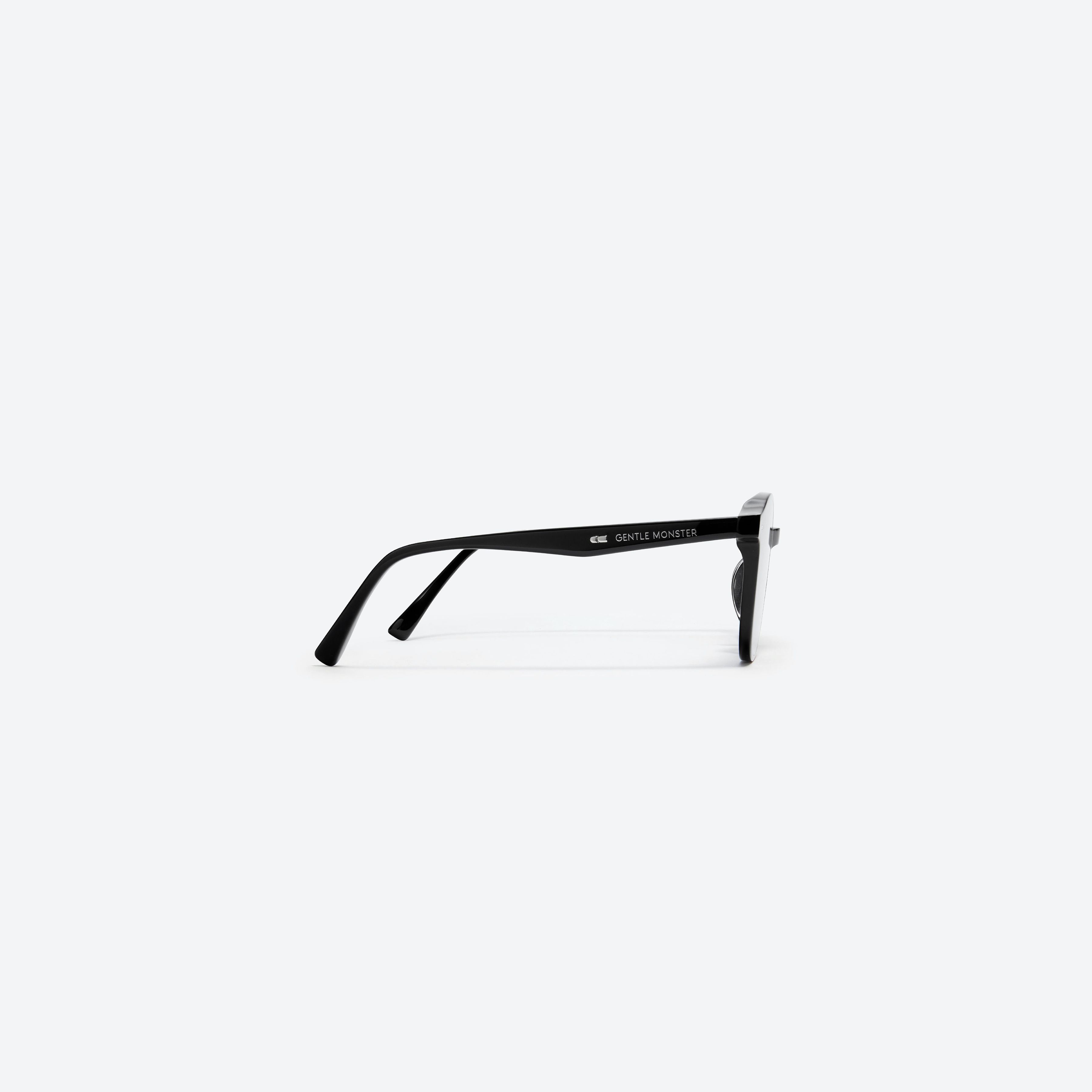 A detailed right view of Gentle Monster Obon 01 Black Acetate framed Round sunglasses.