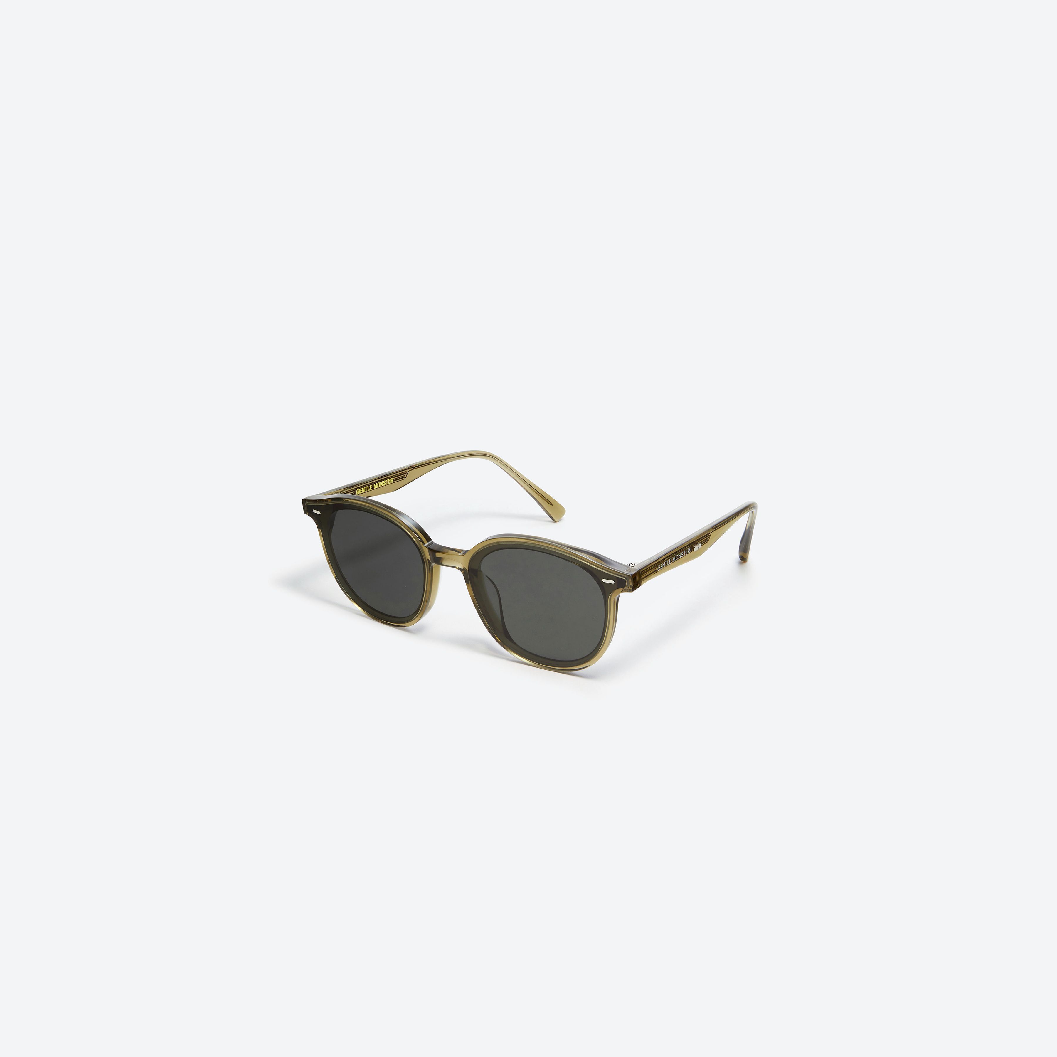 45-degree view of Gentle Monster Obon KC1 Green Acetate framed Round sunglasses.