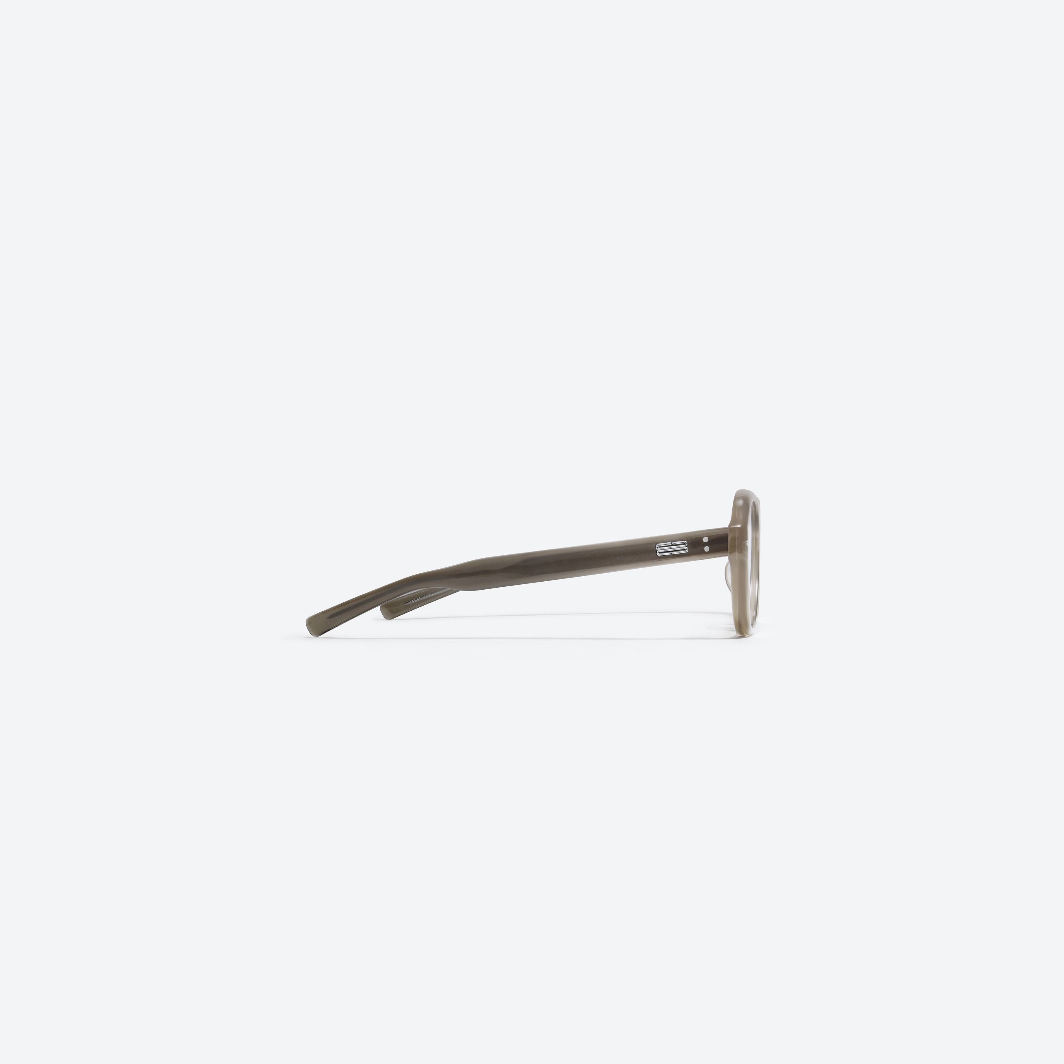 A detailed right view of Gentle Monster Oaa BRC9 Brown Acetate framed Aviator glasses.