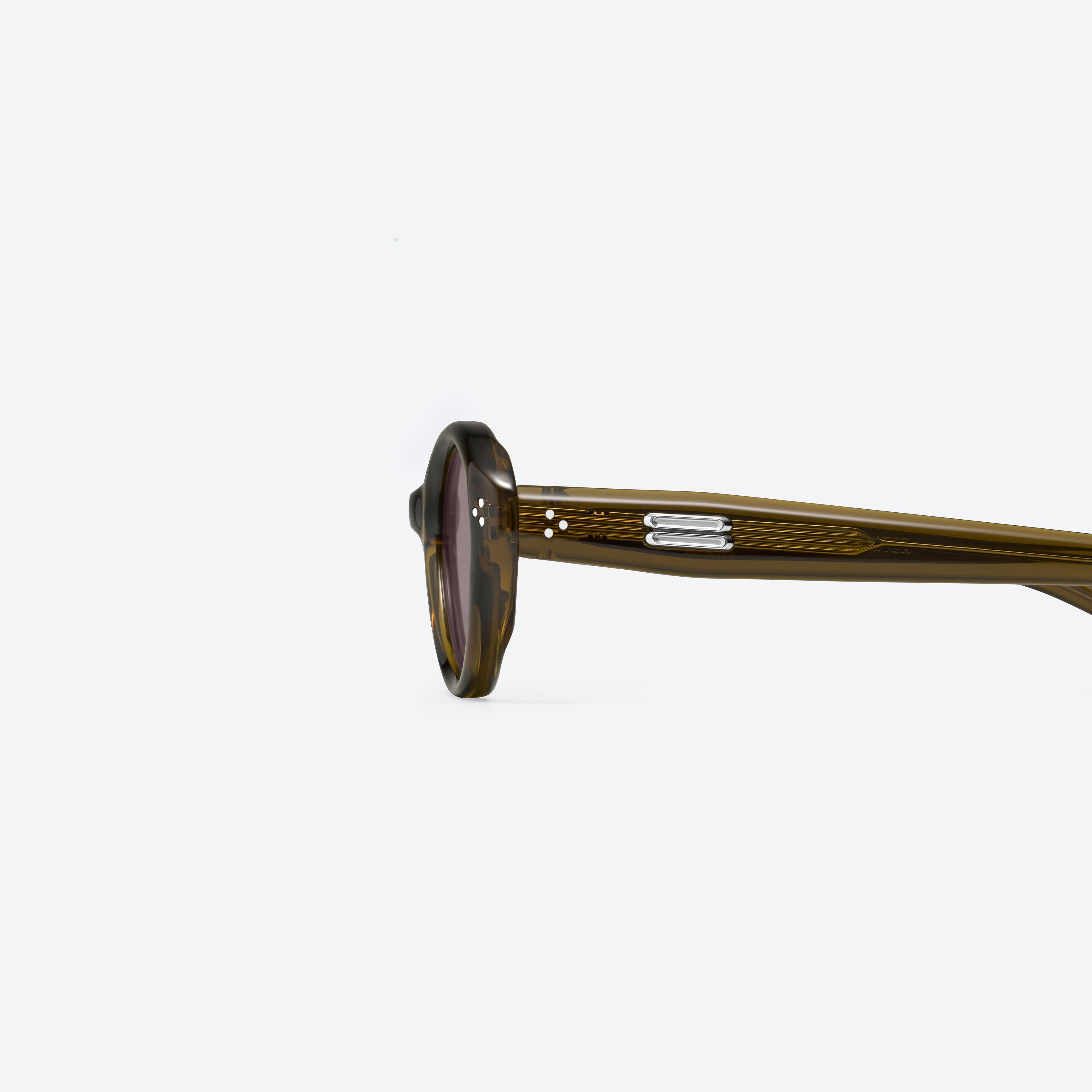 A detailed left view of Gentle Monster Cuscus BRC20 Brown Acetate framed Oval sunglasses.