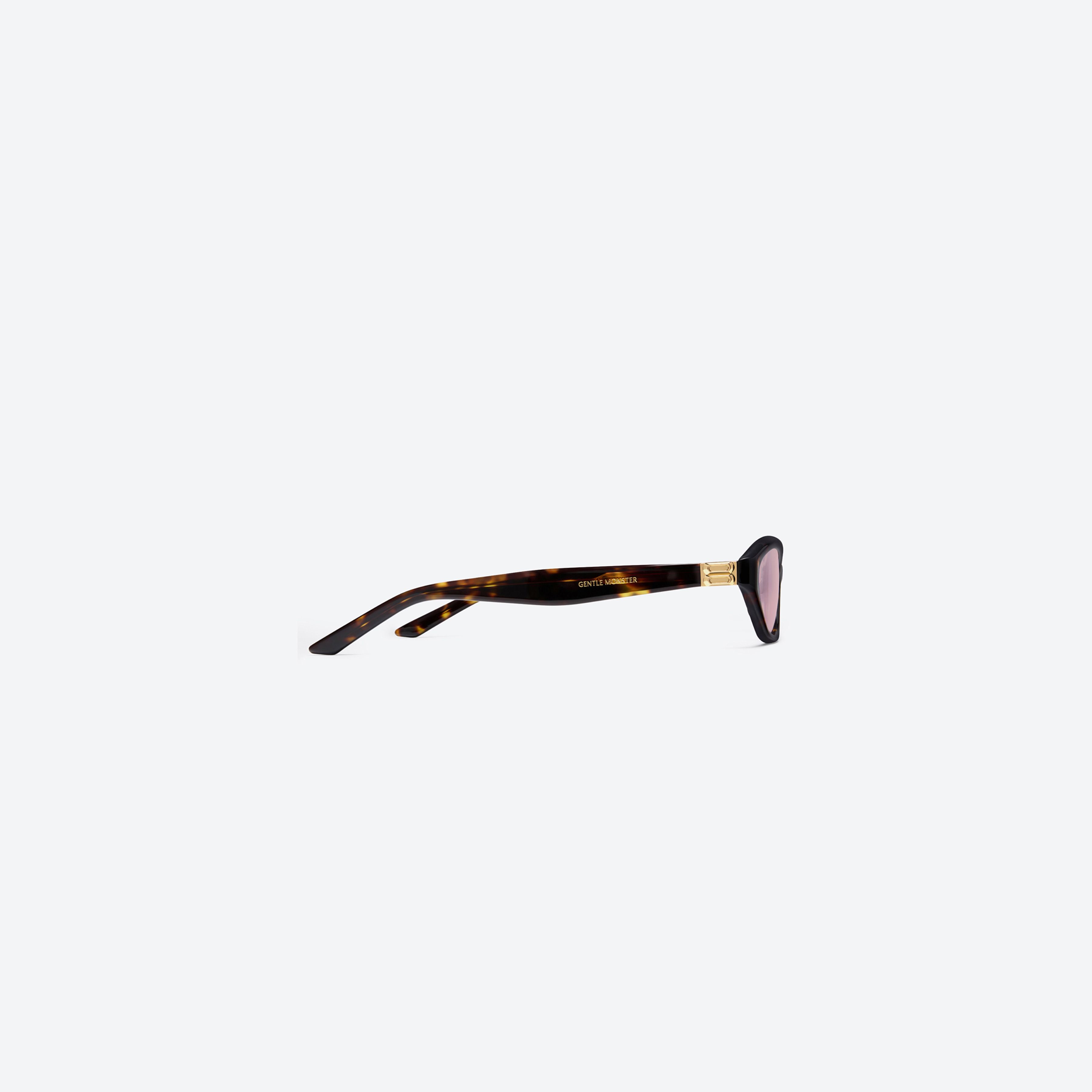 A detailed right view of Gentle Monster Lamda T9 Tortoise Acetate framed Cat-eye sunglasses.