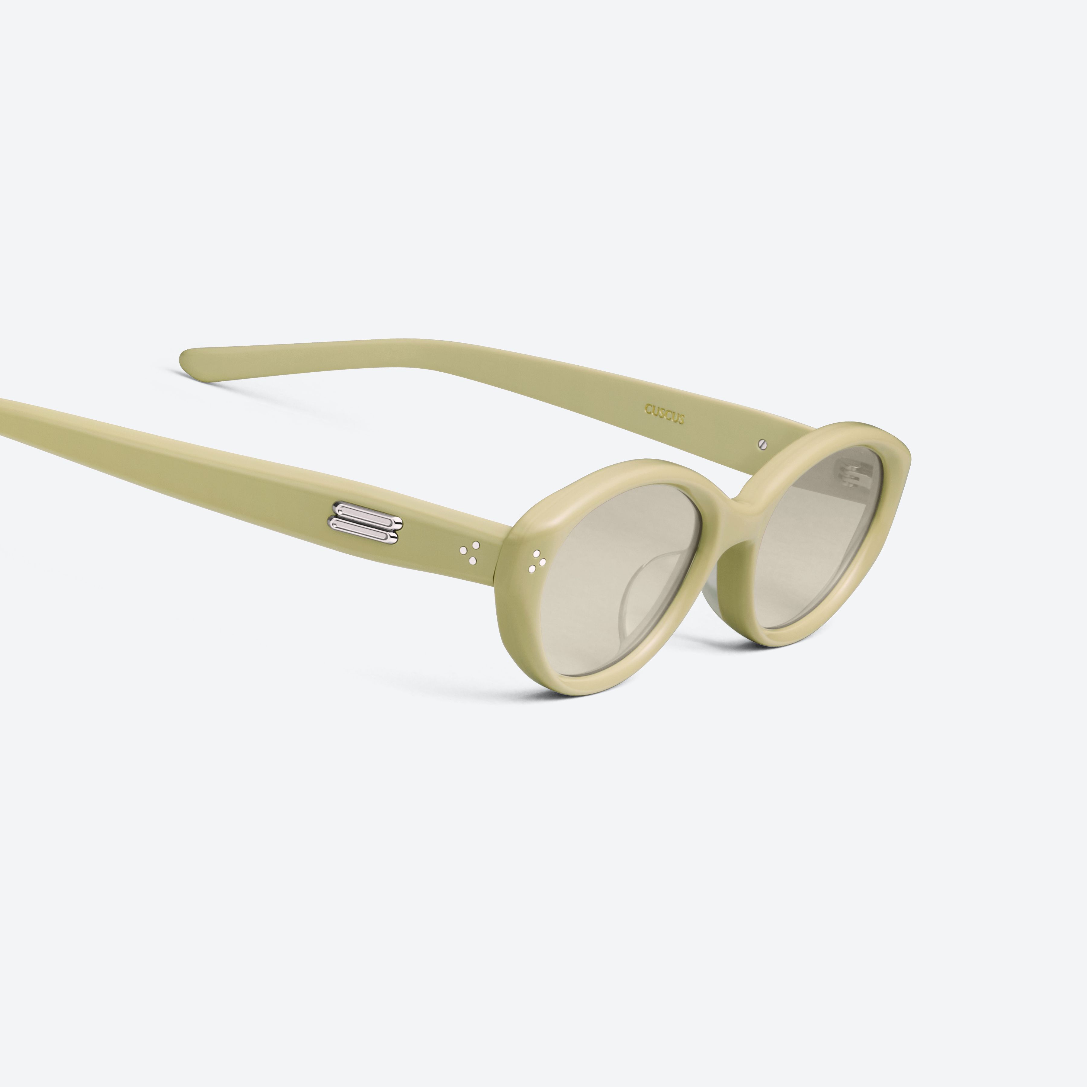 45-degree detailed view of Gentle Monster Cuscus Y11 Yellow Acetate framed Oval sunglasses.