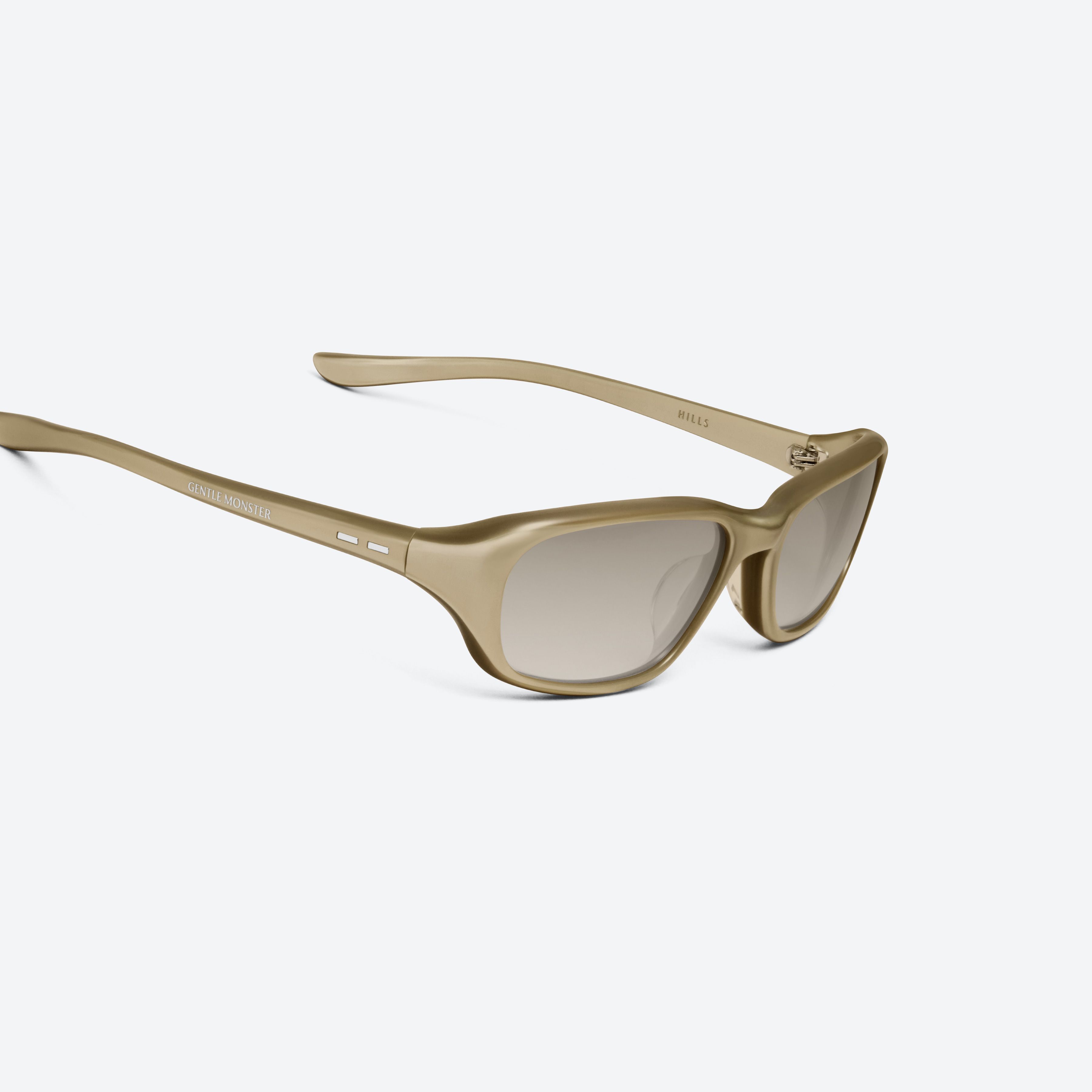 45-degree detailed view of Gentle Monster Hills GDC2 Gold Acetate framed Wraparound sunglasses.
