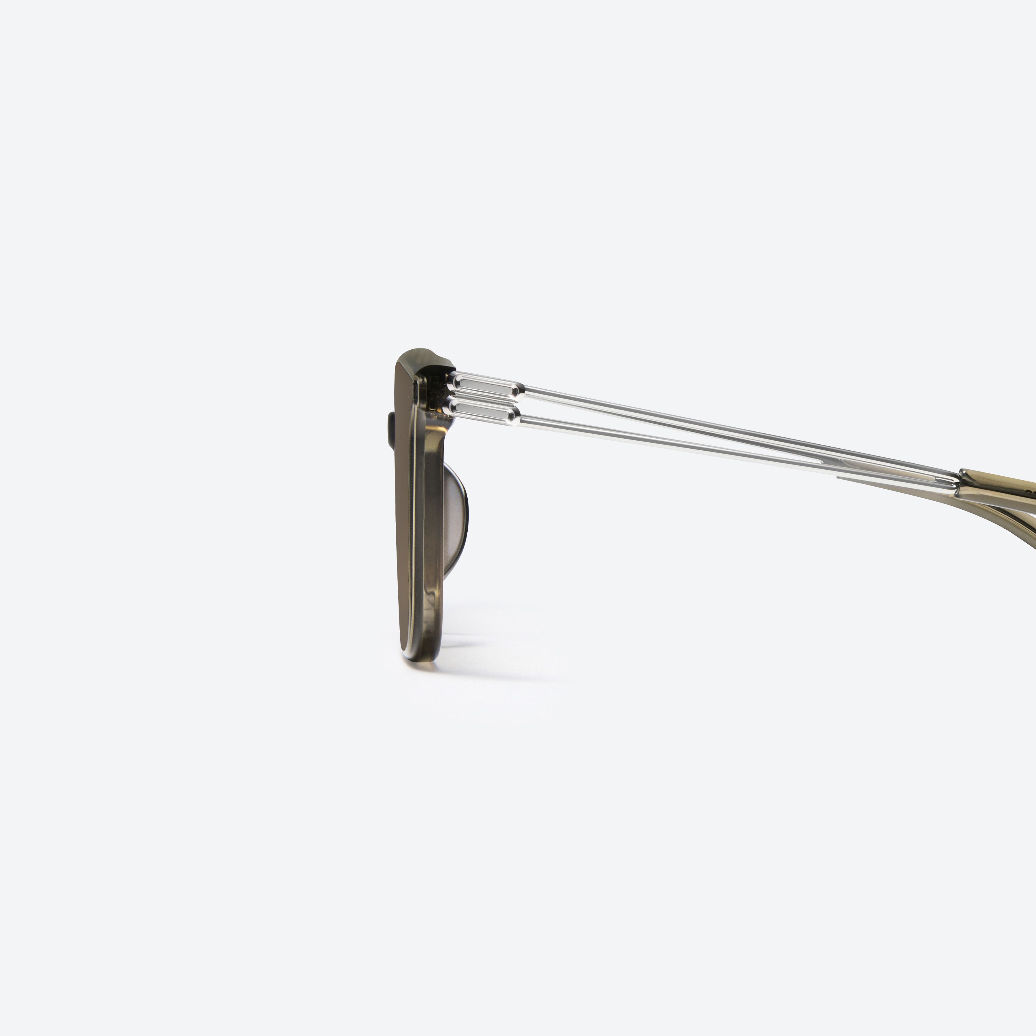 A detailed left view of Gentle Monster La Sola KC6 Green Mixed framed Square sunglasses.