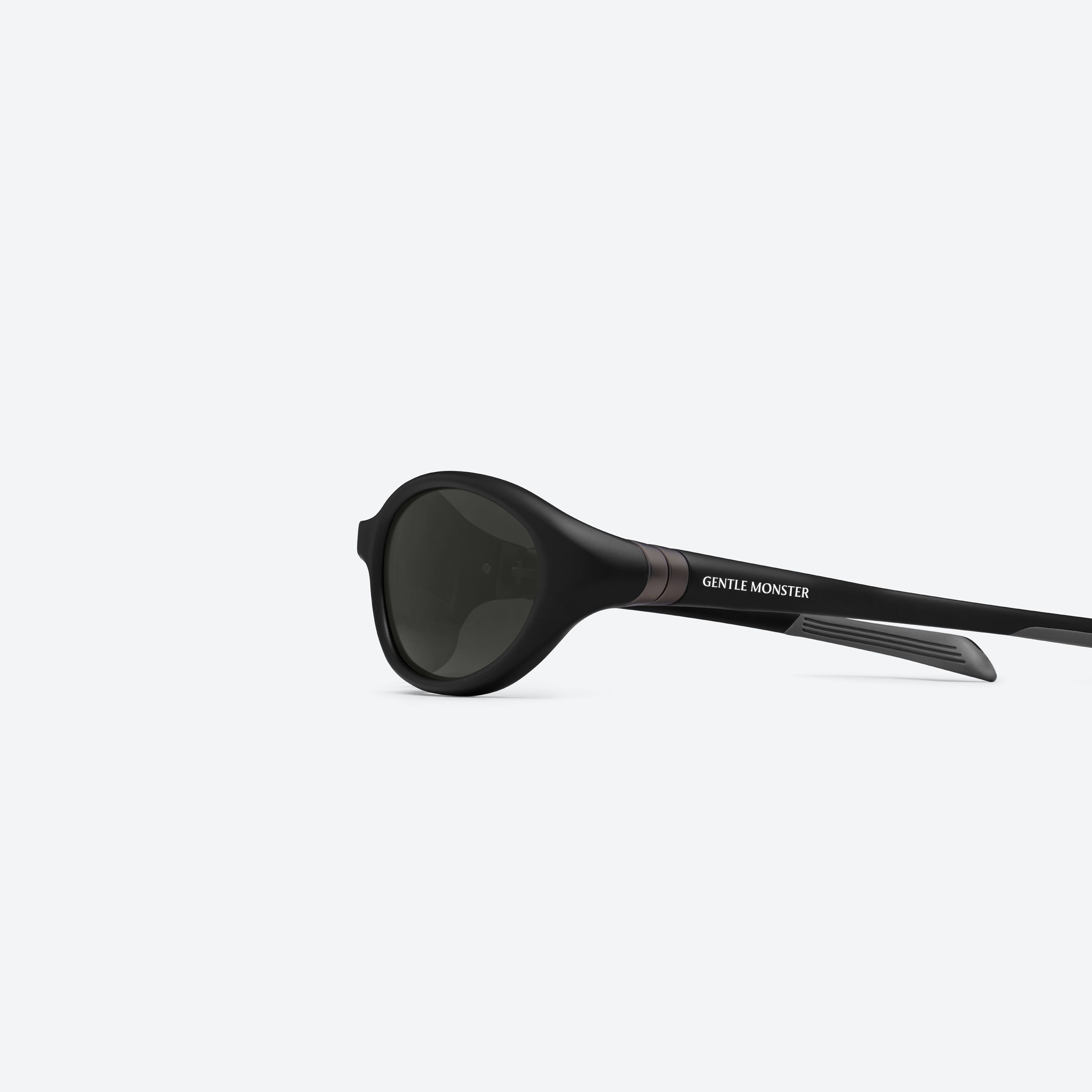 A detailed left view of Gentle Monster Velo M01 Black Nylon framed Wraparound sunglasses.