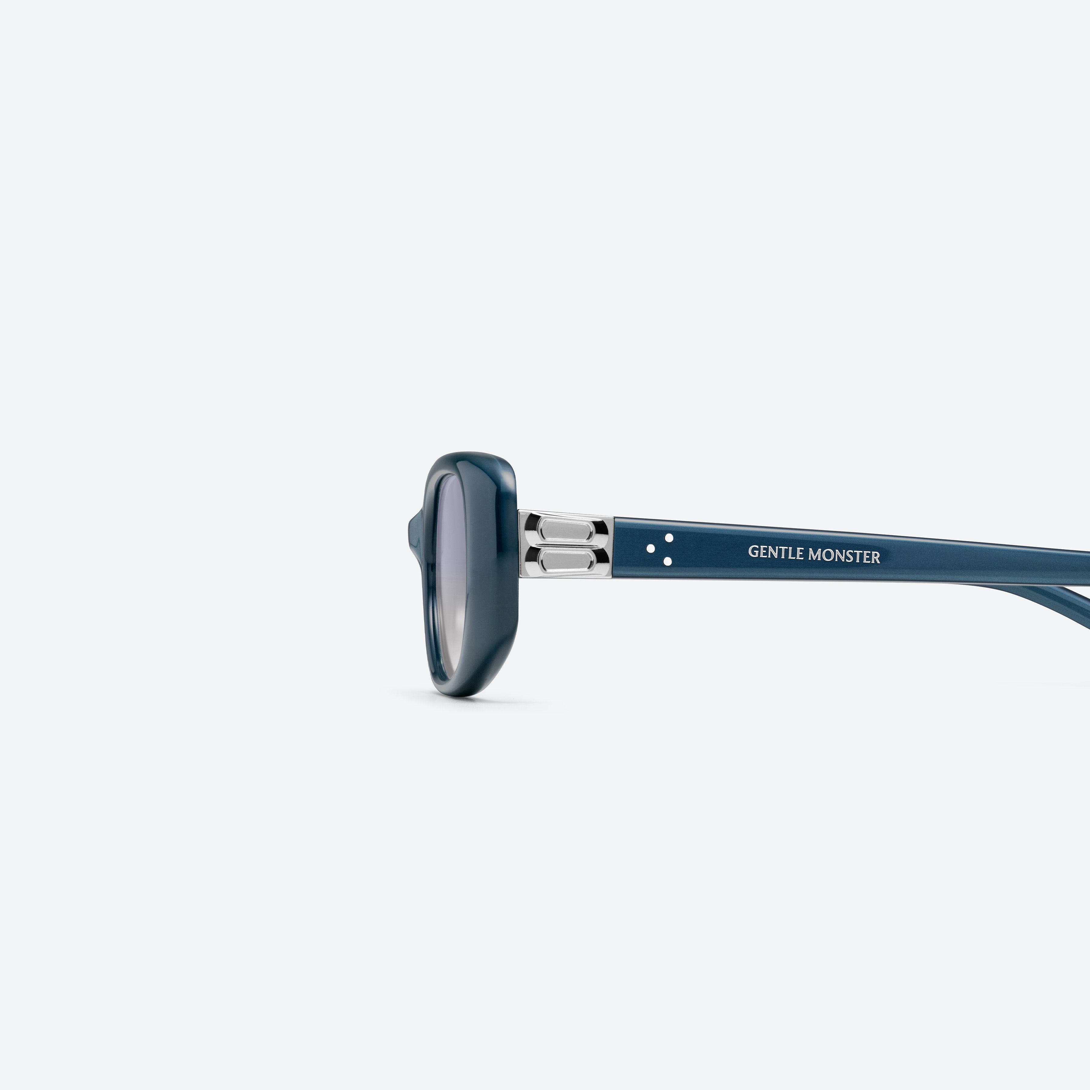A detailed left view of Gentle Monster Dust Musk BL9 Blue Acetate framed Square sunglasses.