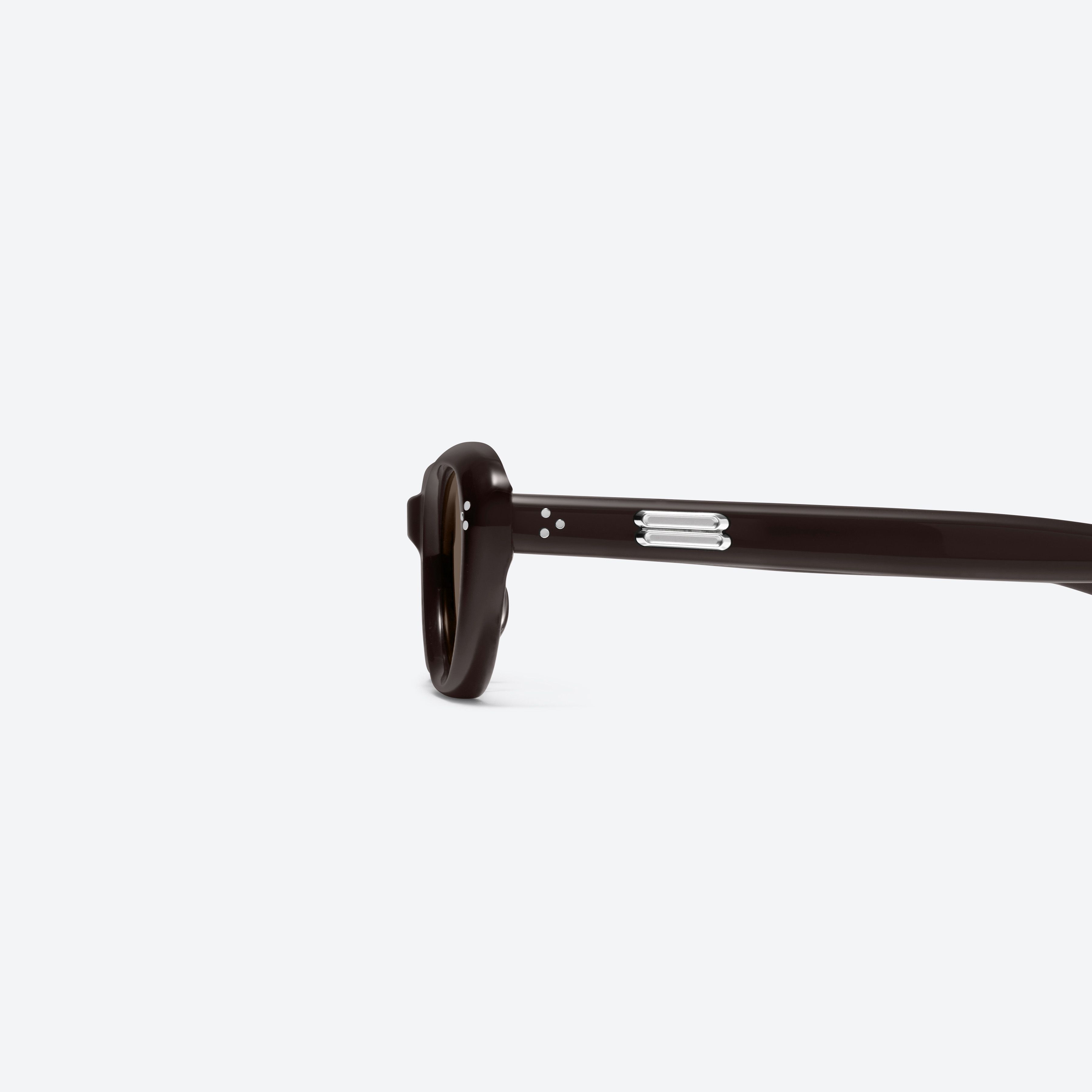 A detailed left view of Gentle Monster Madlenne BR2 Brown Acetate framed Cat-eye sunglasses.