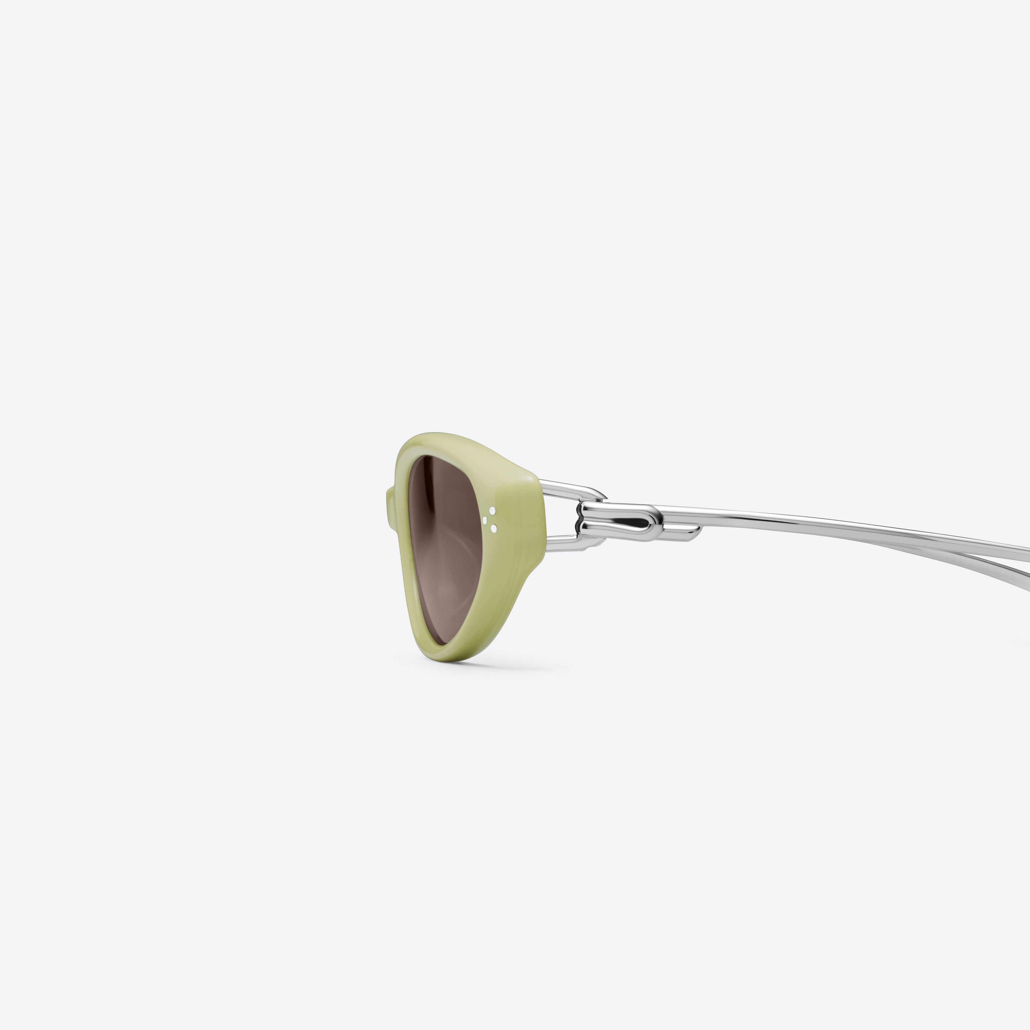 A detailed left view of Gentle Monster Crepe GR9 Green Mixed framed Cat-eye sunglasses.
