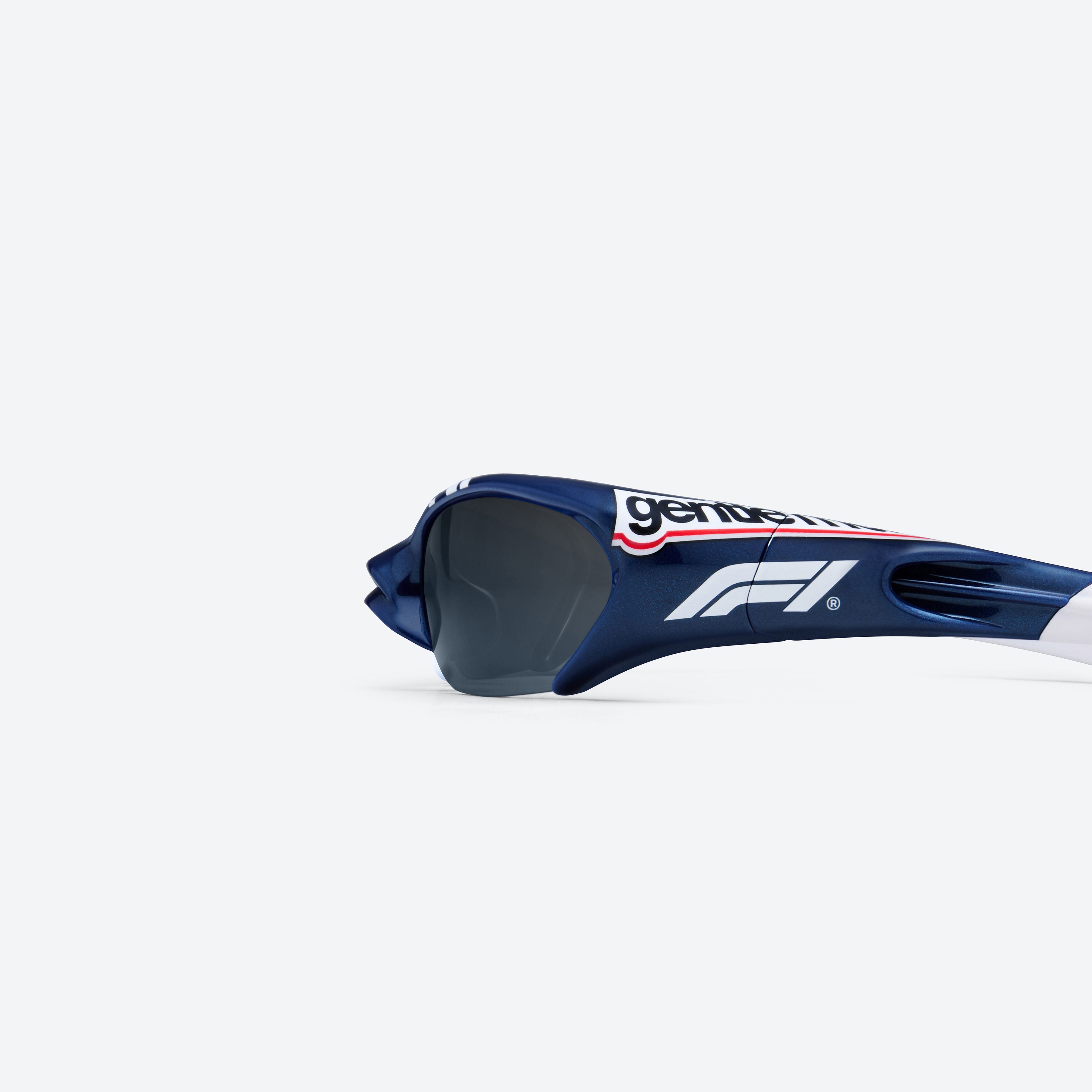 A detailed left view of Gentle Monster Disney F1 - Slipstream N8 Blue Nylon framed Wraparound sunglasses.