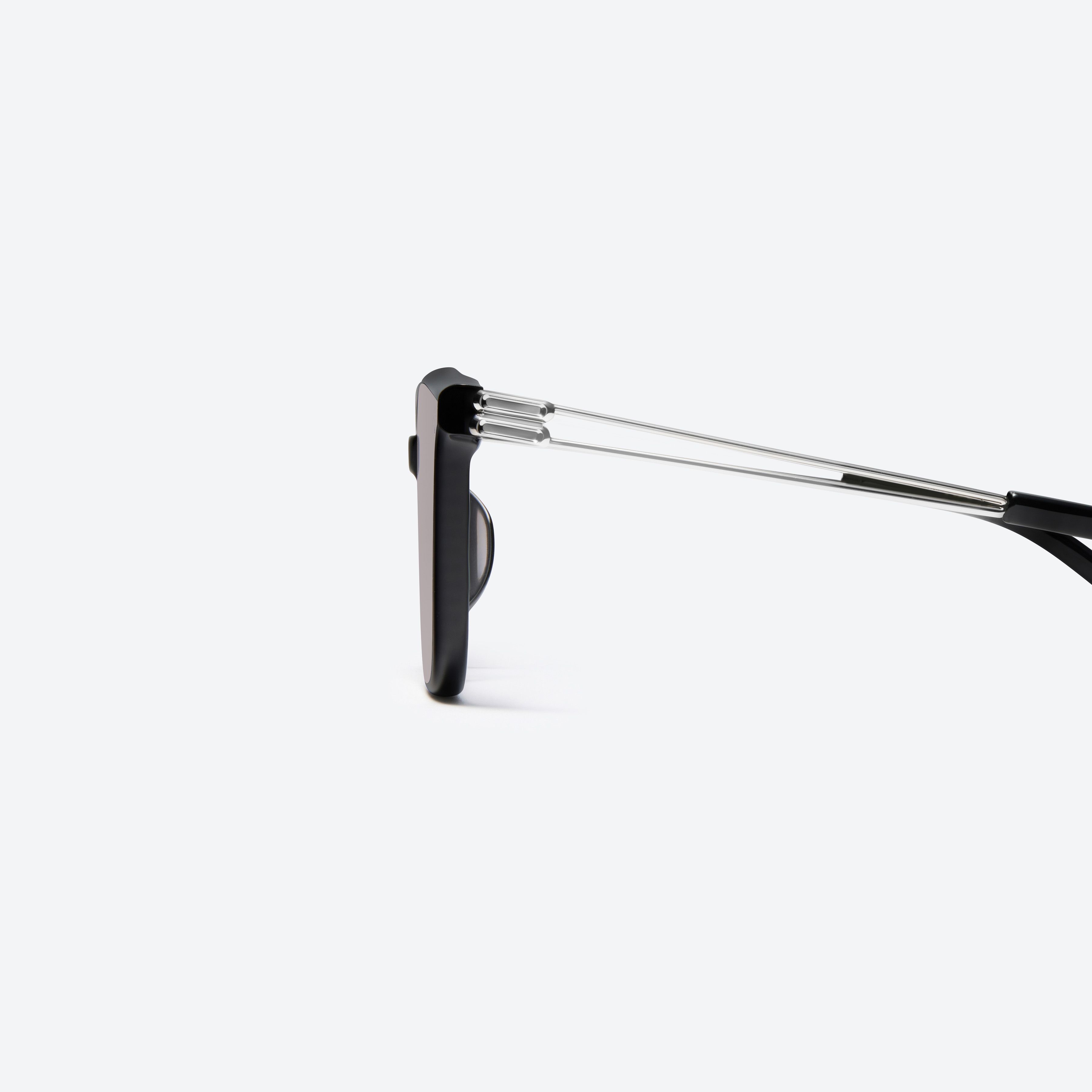 A detailed left view of Gentle Monster La Sola 01(G) Black Mixed framed Square sunglasses.