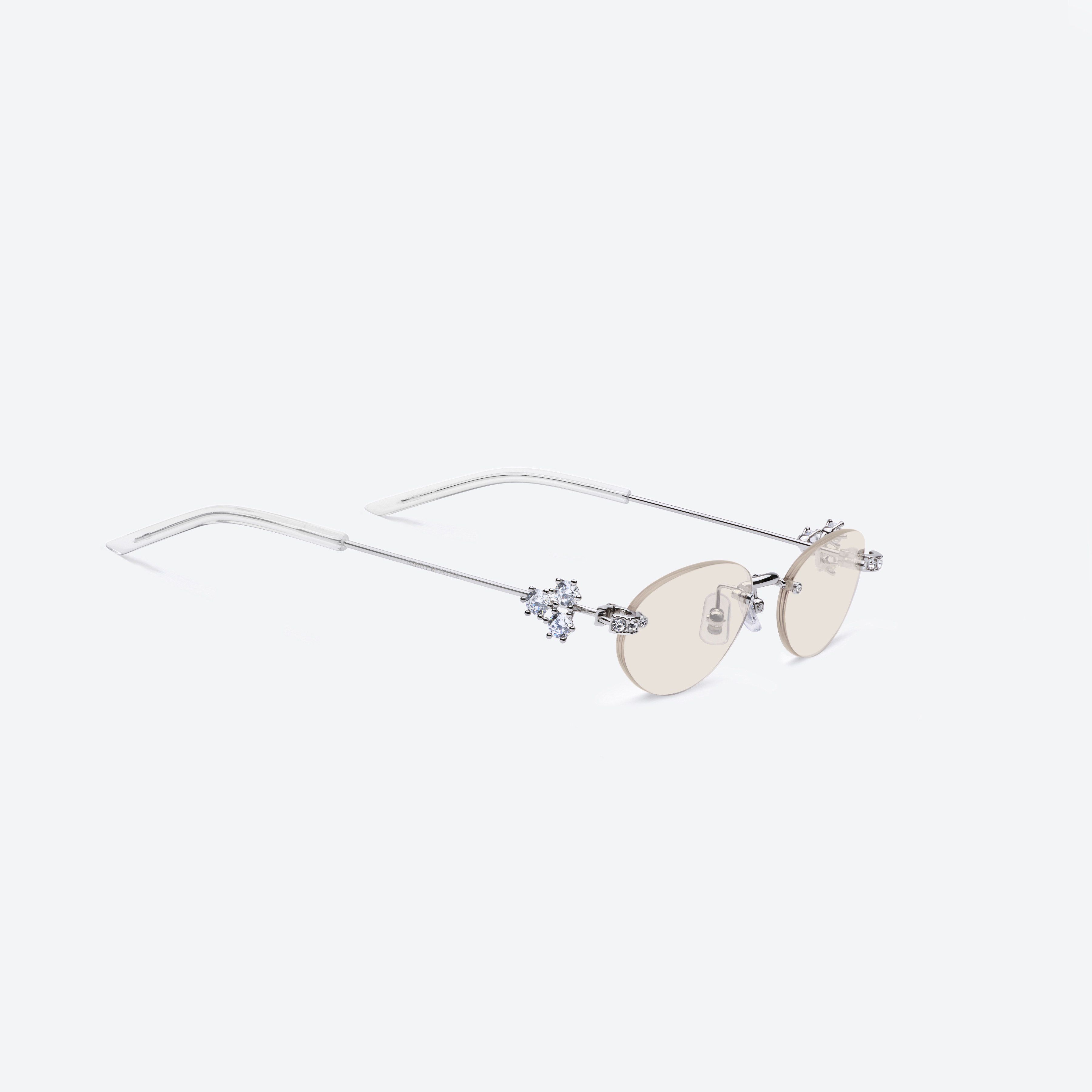 45-degree detailed view of Gentle Monster Orora 02(BRM) Silver Metal framed Oval sunglasses.