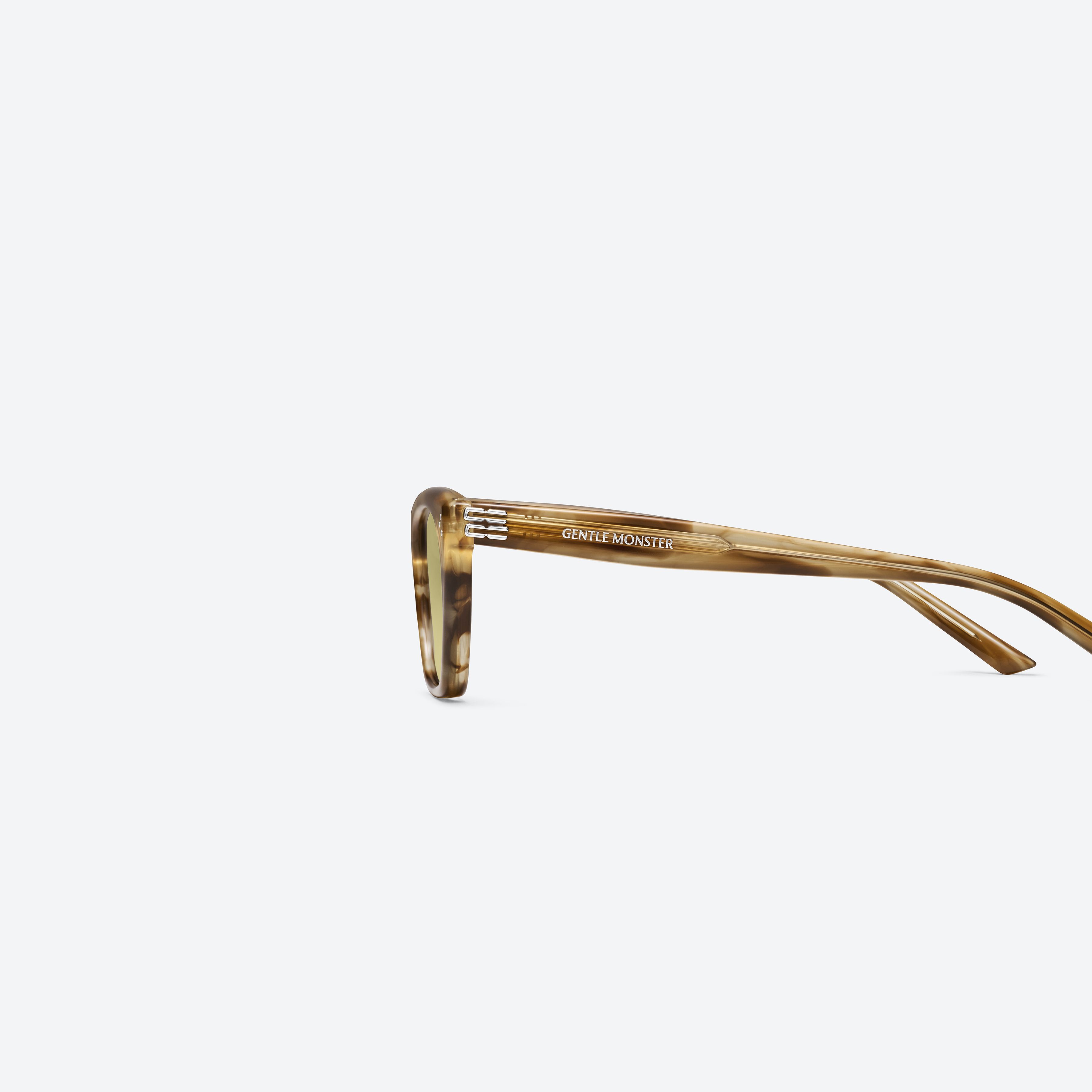 A detailed left view of Gentle Monster Gisele T8 Tortoise Acetate framed Cat-eye sunglasses.