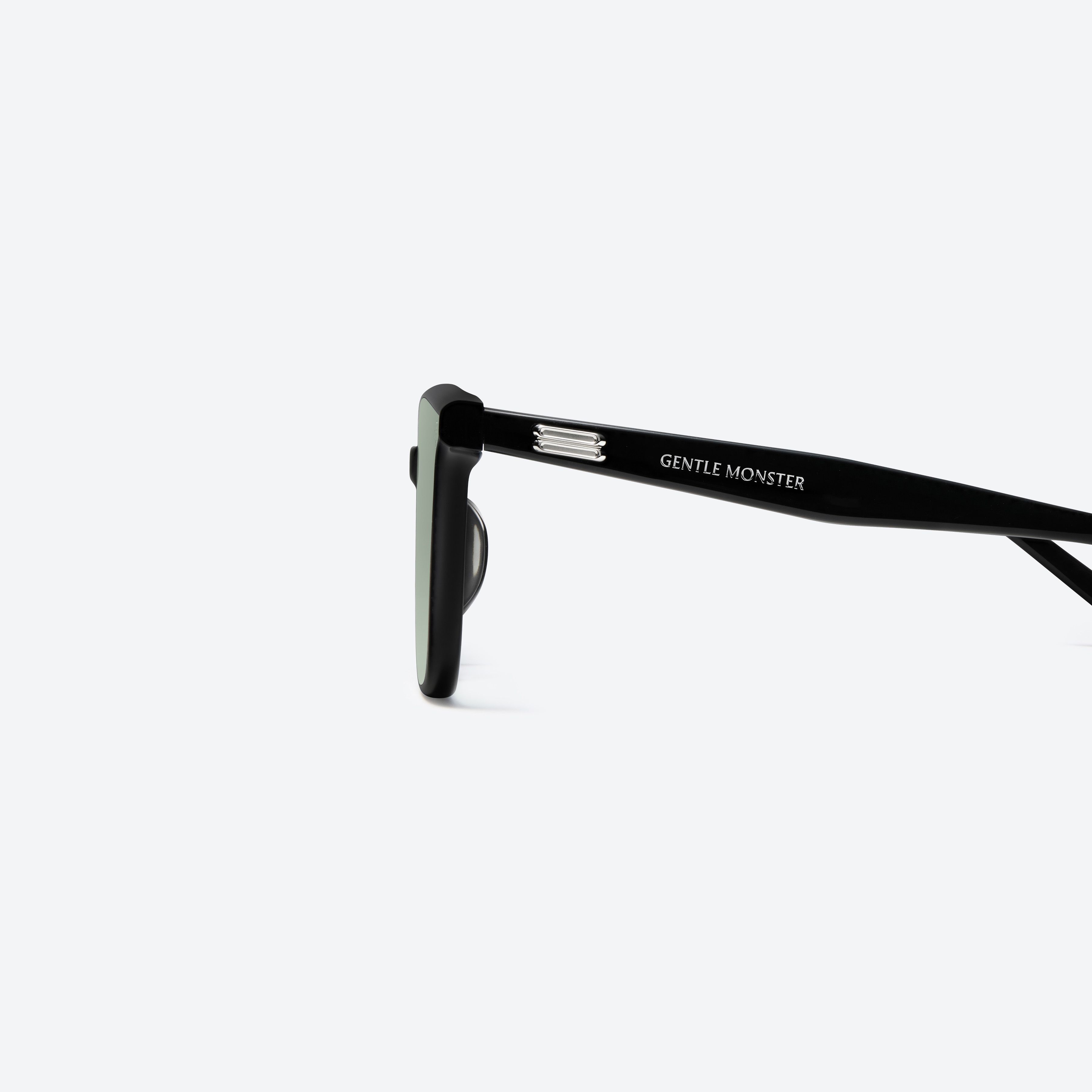 A detailed left view of Gentle Monster Lo Lou 01(GR) Black Acetate framed Square sunglasses.