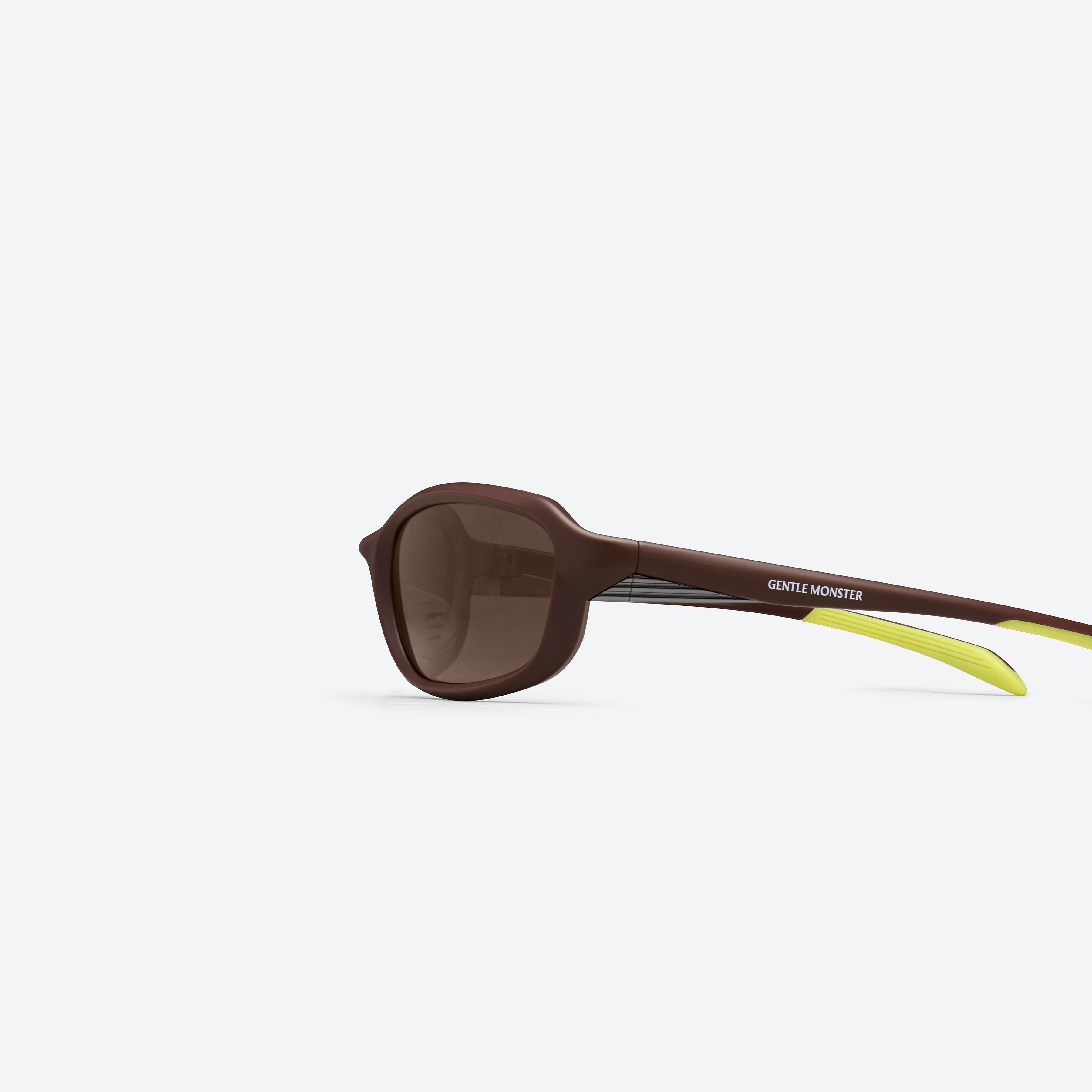 A detailed left view of Gentle Monster Volt MBR5 Brown Nylon framed Wraparound sunglasses.