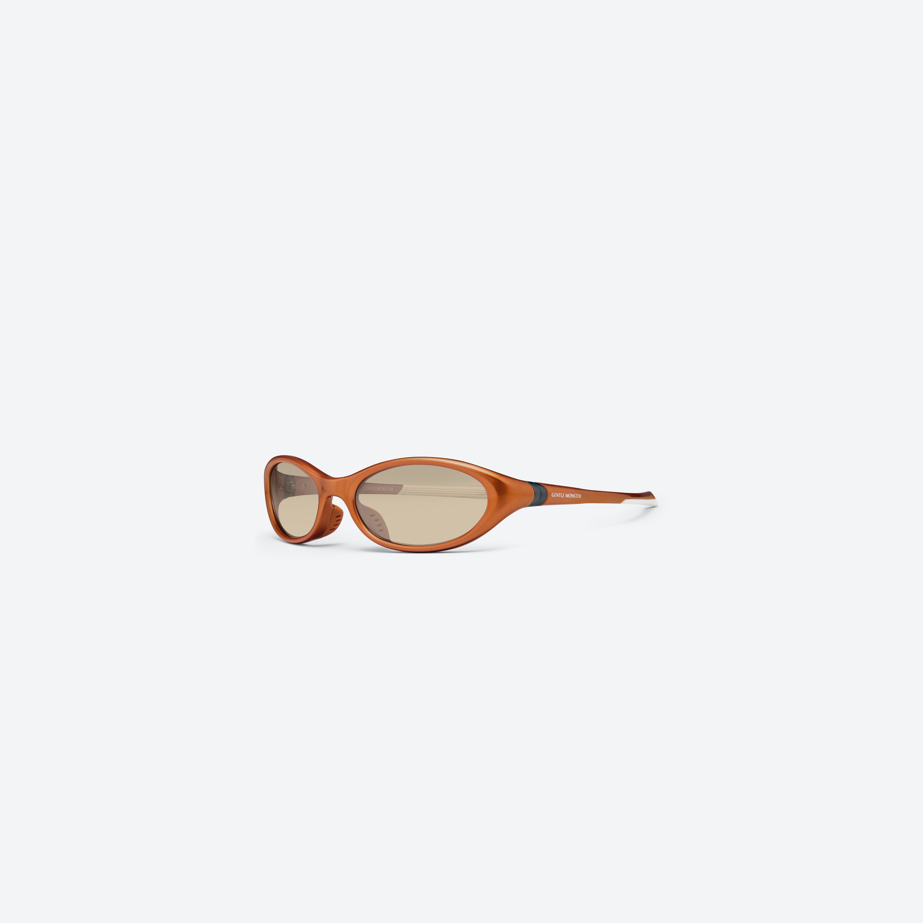45-degree view of Gentle Monster Velo OR4 Orange Nylon framed Wraparound sunglasses.