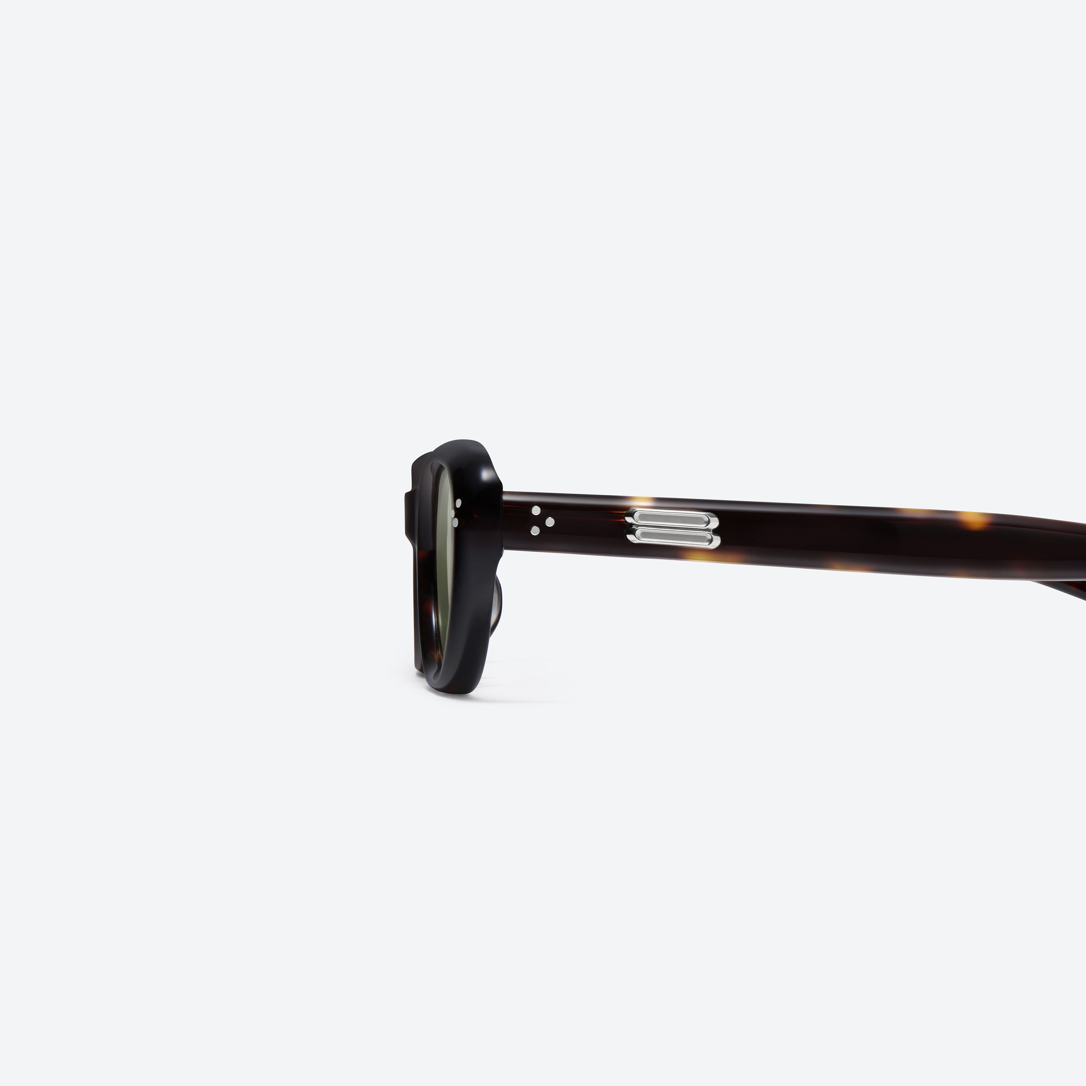 A detailed left view of Gentle Monster Madlenne T9 Tortoise Acetate framed Cat-eye sunglasses.