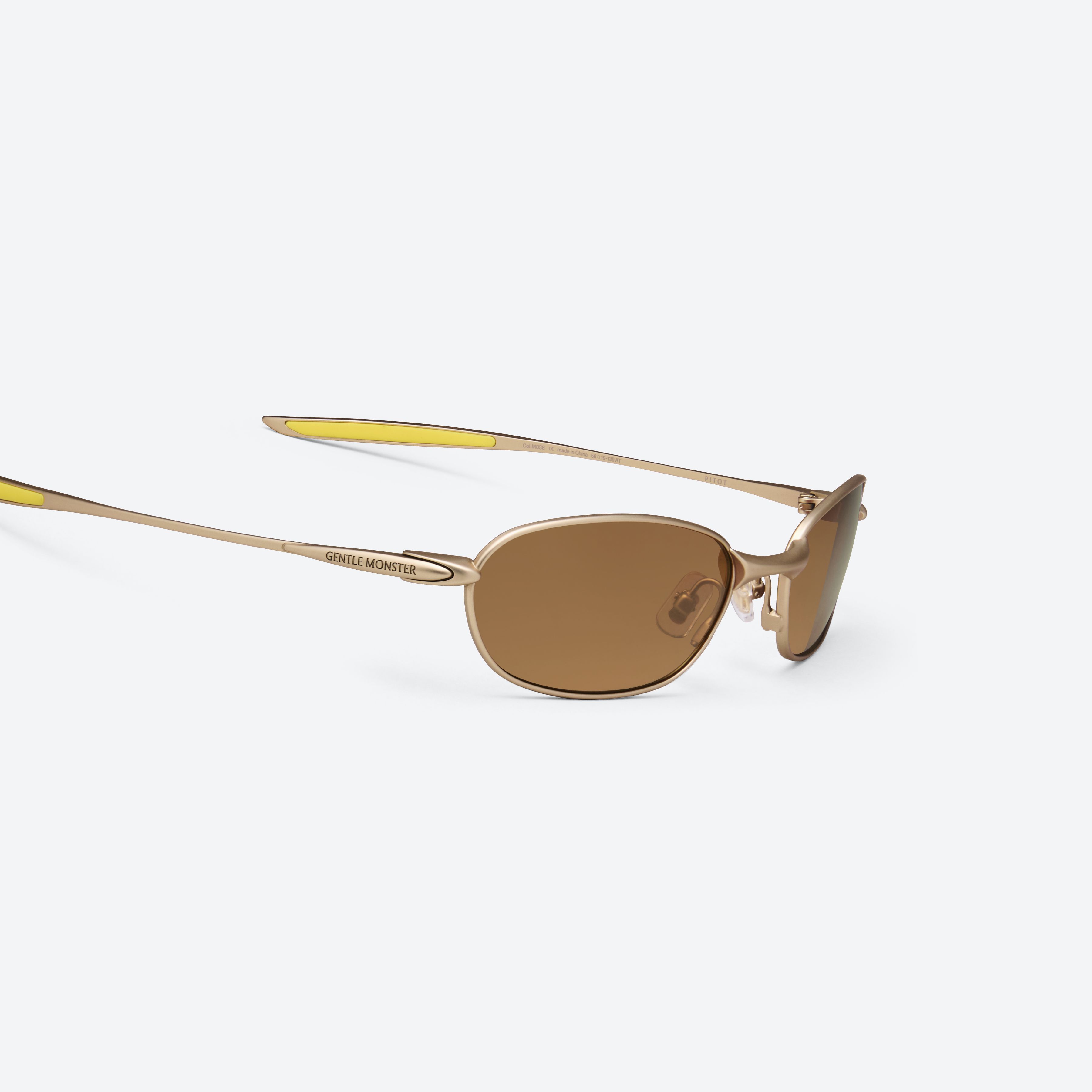45-degree detailed view of Gentle Monster Pitot M038 Gold Metal framed Wraparound sunglasses.