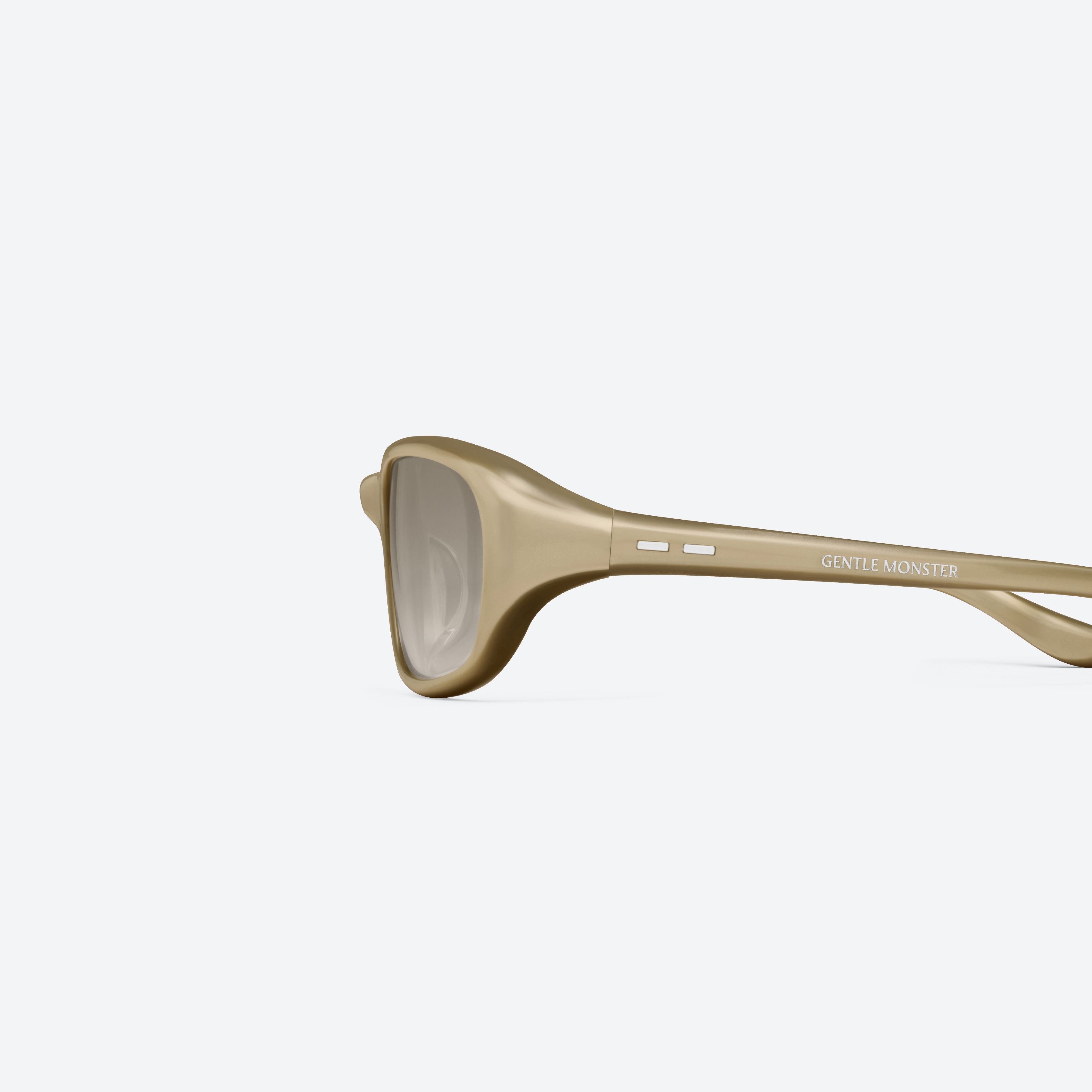 A detailed left view of Gentle Monster Hills GDC2 Gold Acetate framed Wraparound sunglasses.