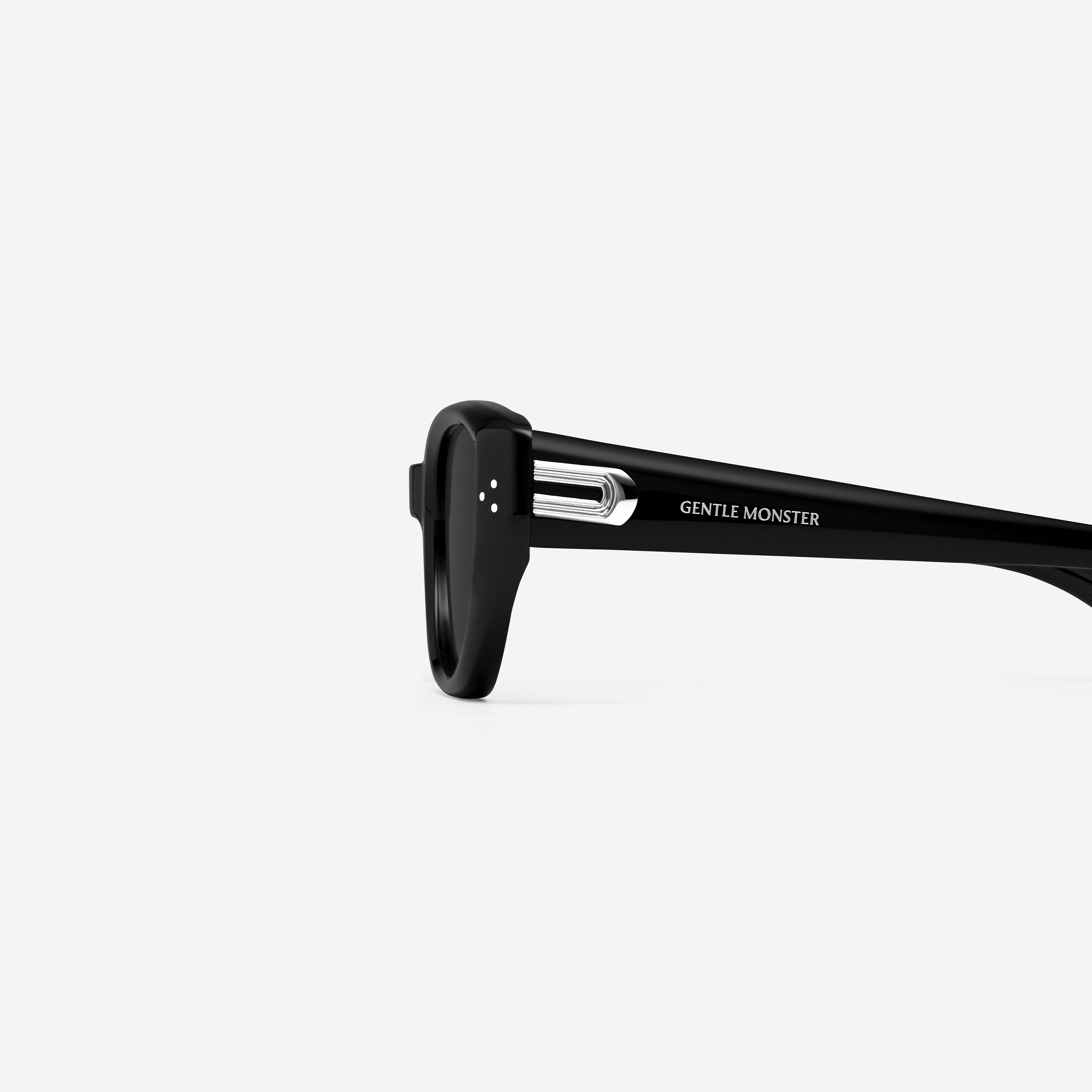 A detailed left view of Gentle Monster Boni 01 Black Acetate framed Cat-eye sunglasses.