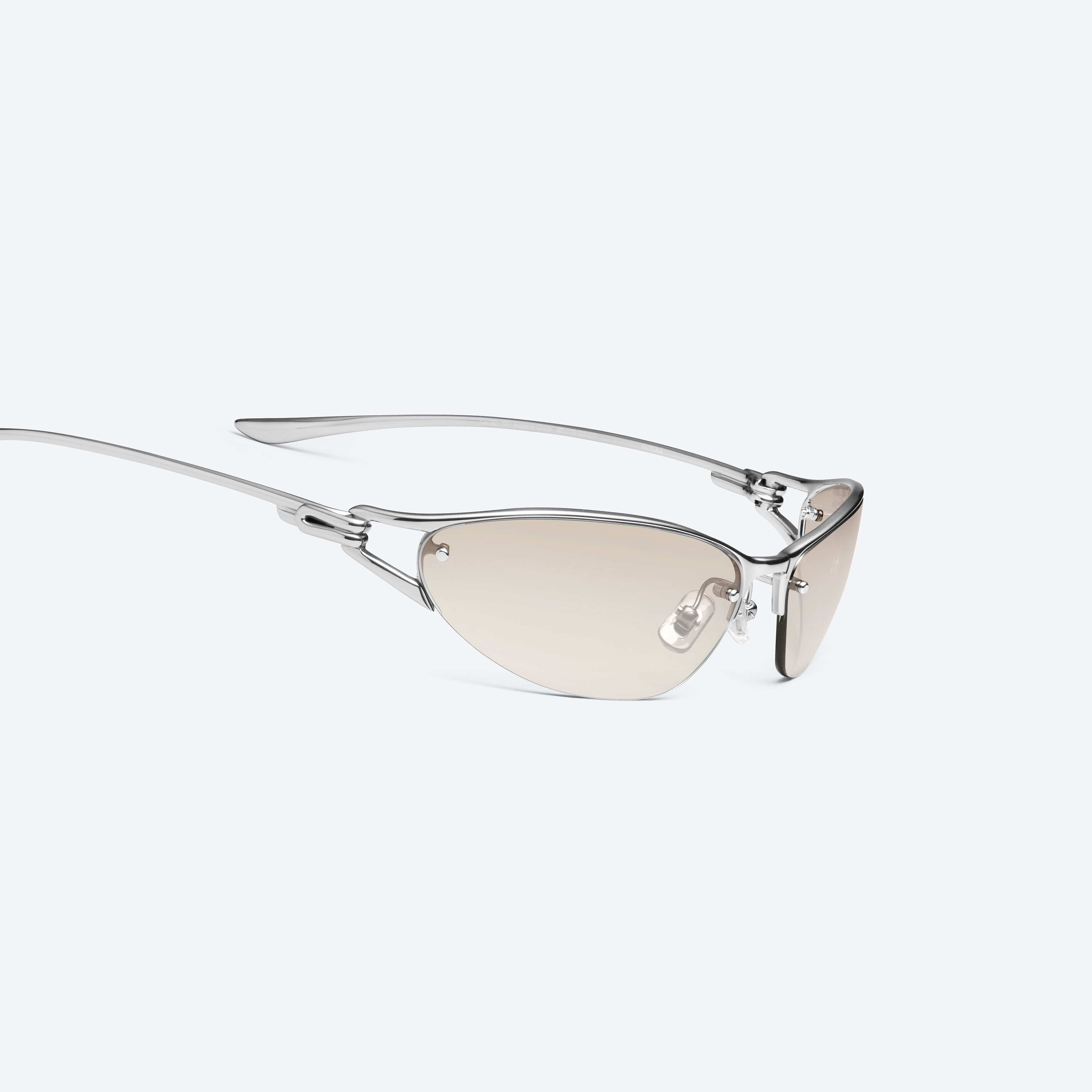 45-degree detailed view of Gentle Monster Futura 02 Silver Metal framed Wraparound sunglasses.