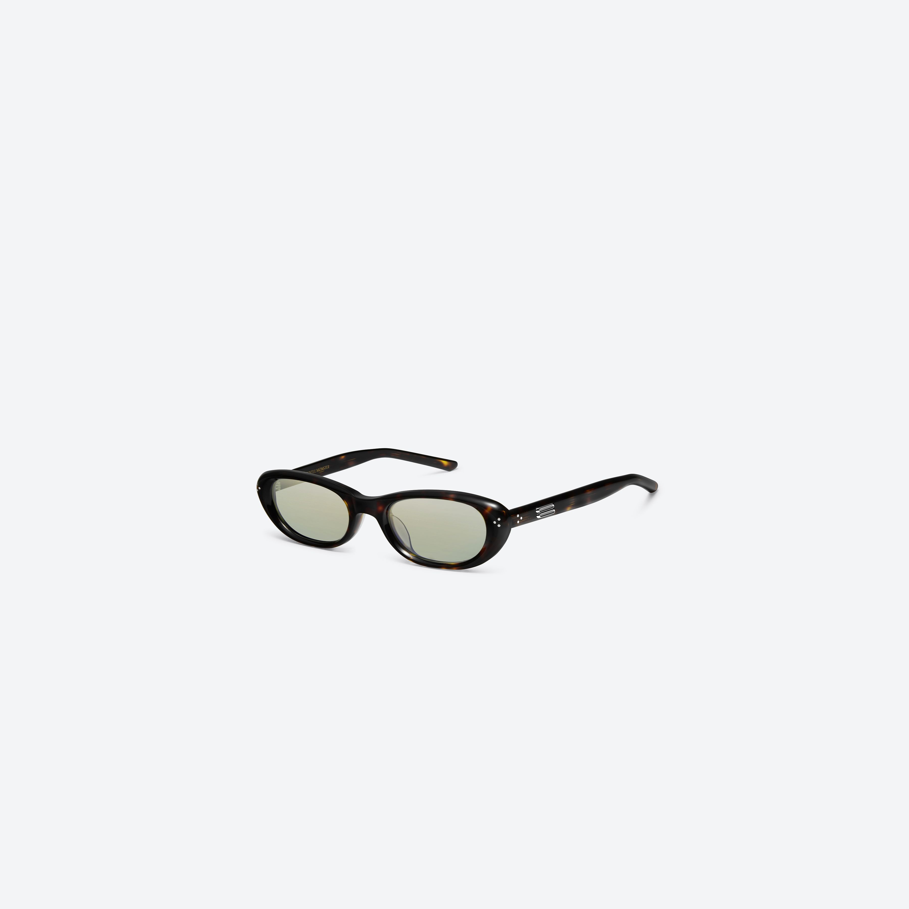 45-degree view of Gentle Monster Madlenne T9 Tortoise Acetate framed Cat-eye sunglasses.