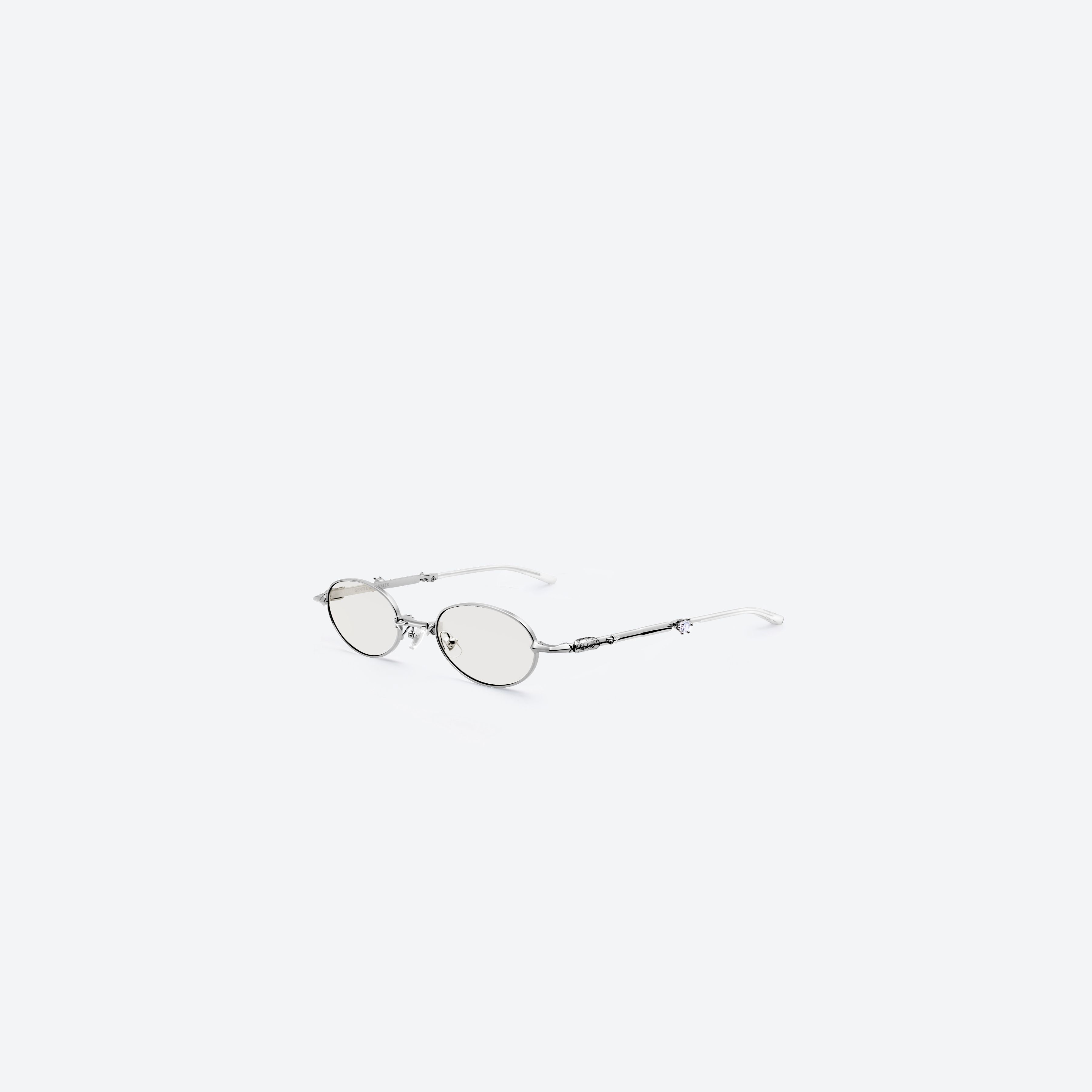 45-degree view of Gentle Monster Pico 02(SM) Silver Metal framed Oval glasses.