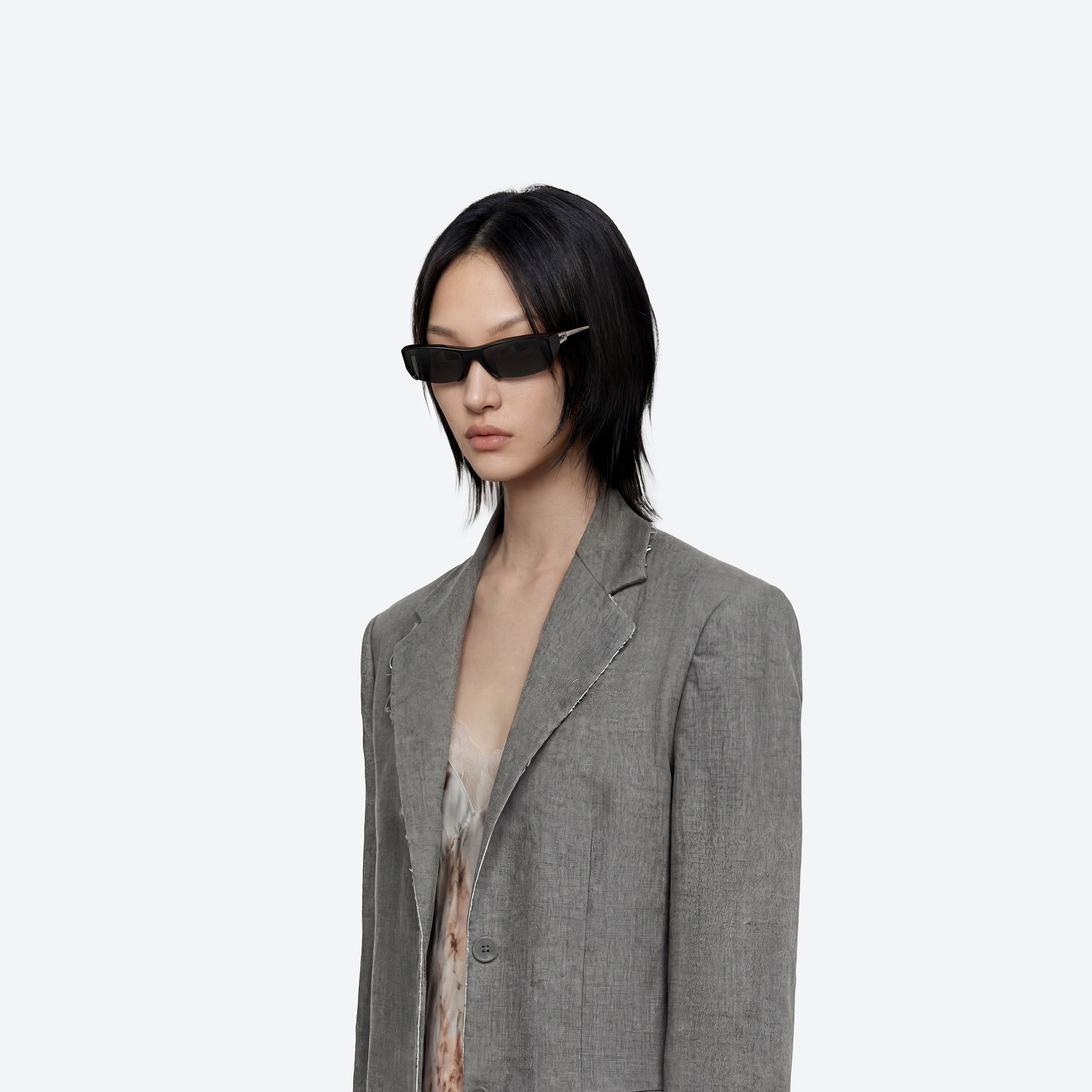 Model wearing the Room 433 01 Black Mixed framed Square sunglasses.