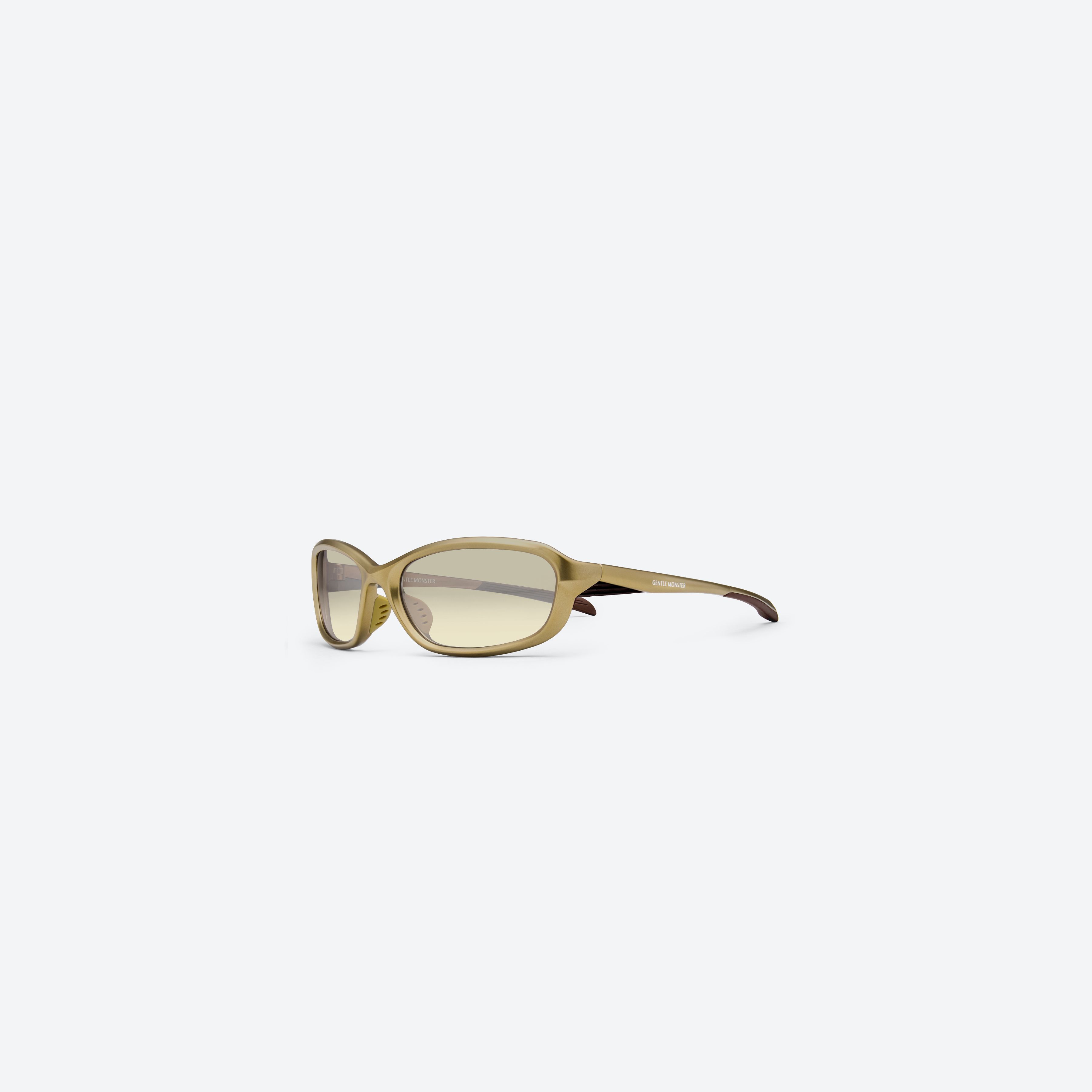 45-degree view of Gentle Monster Volt MGD2 Gold Nylon framed Wraparound sunglasses.