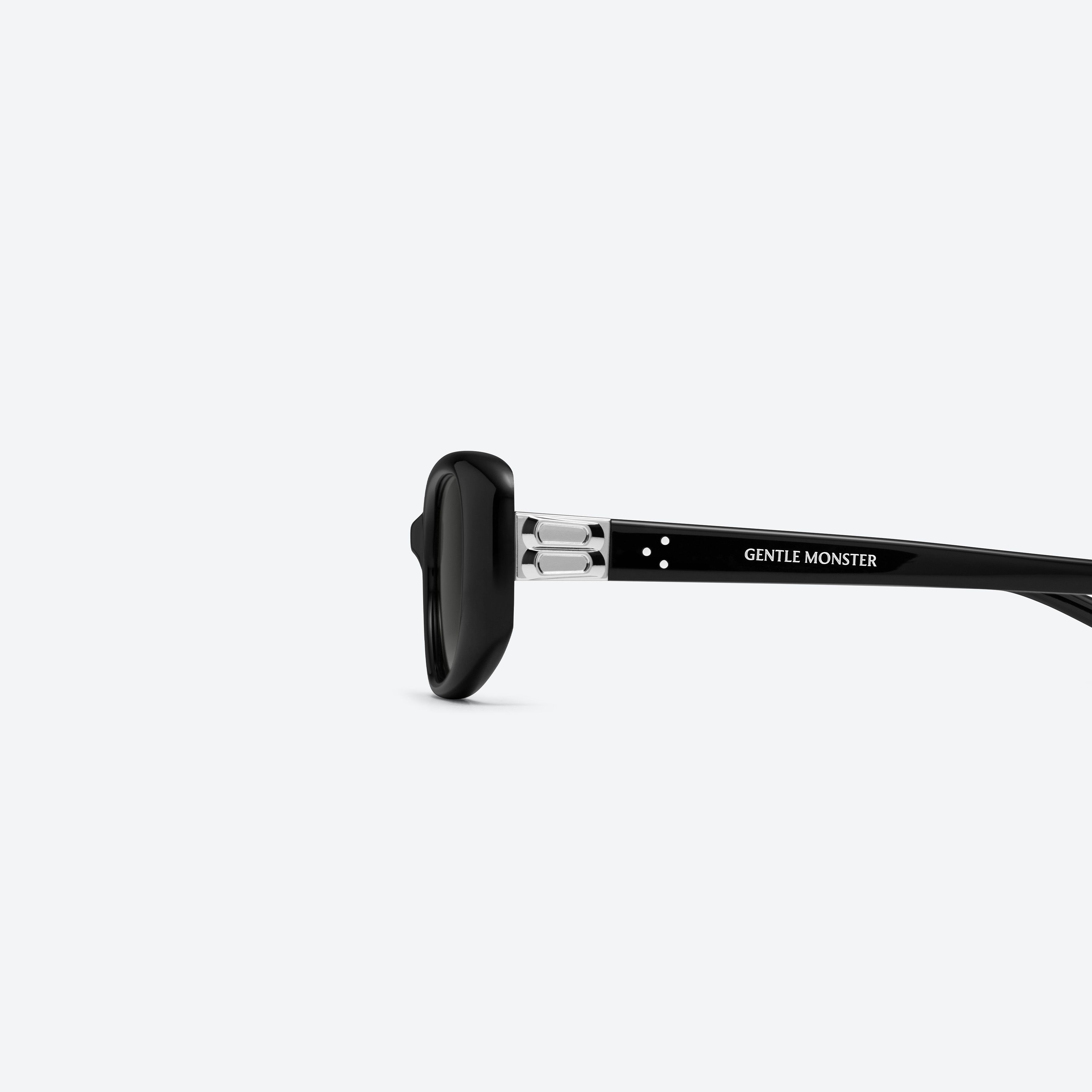 A detailed left view of Gentle Monster Dust Musk 01 Black Acetate framed Square sunglasses.