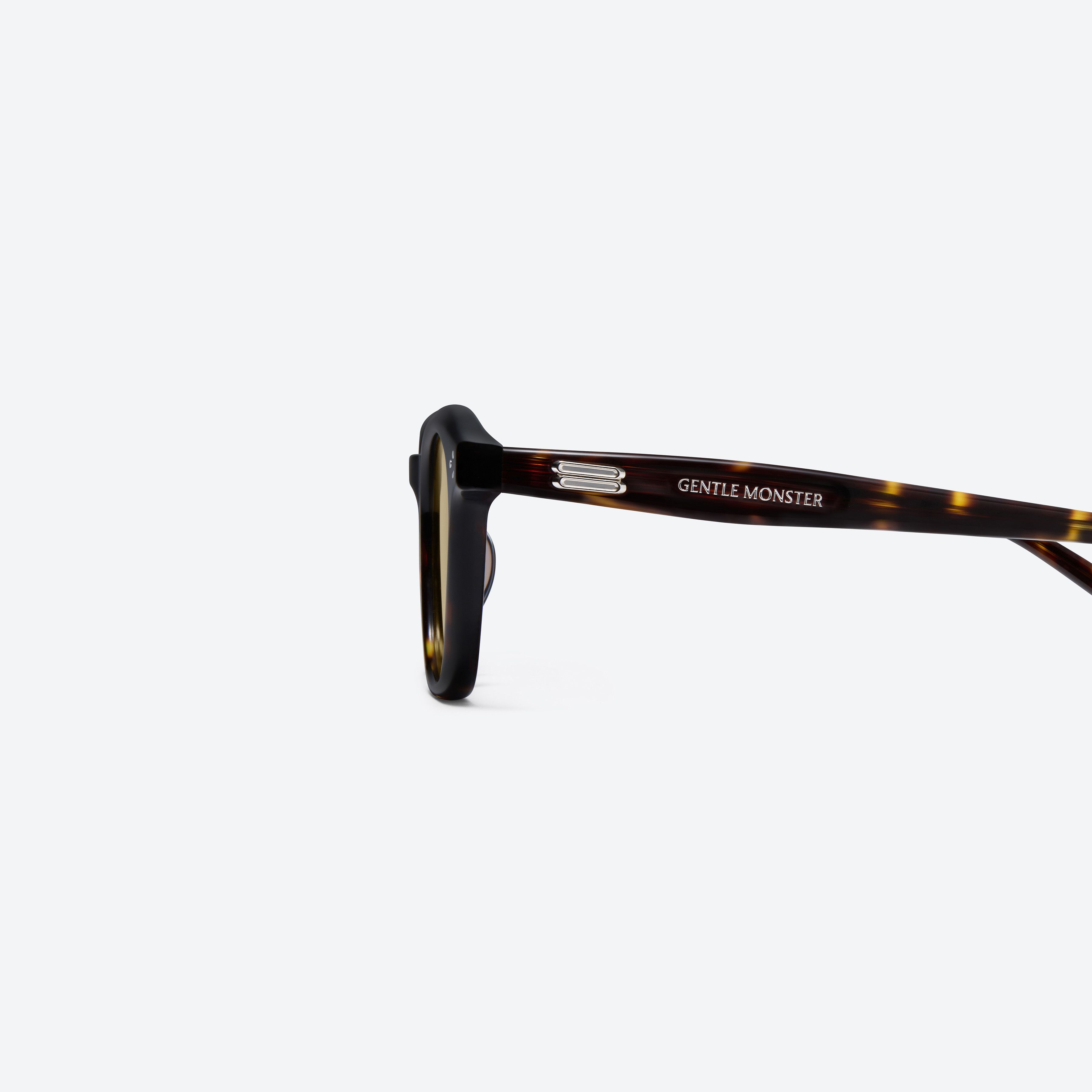 A detailed left view of Gentle Monster Noho T9 Tortoise Acetate framed Round sunglasses.