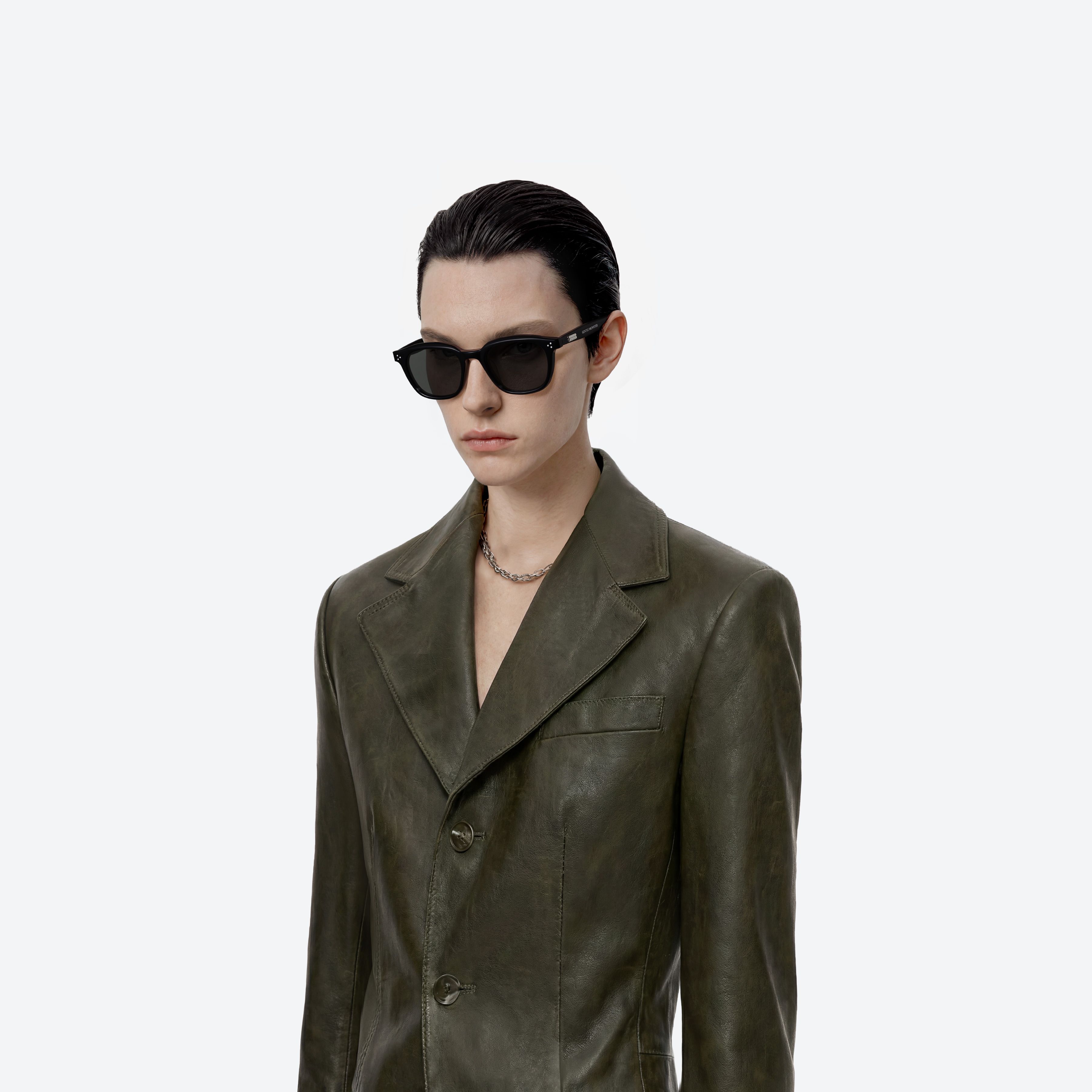 Model wearing the Noho 01 Black Acetate framed Round sunglasses.