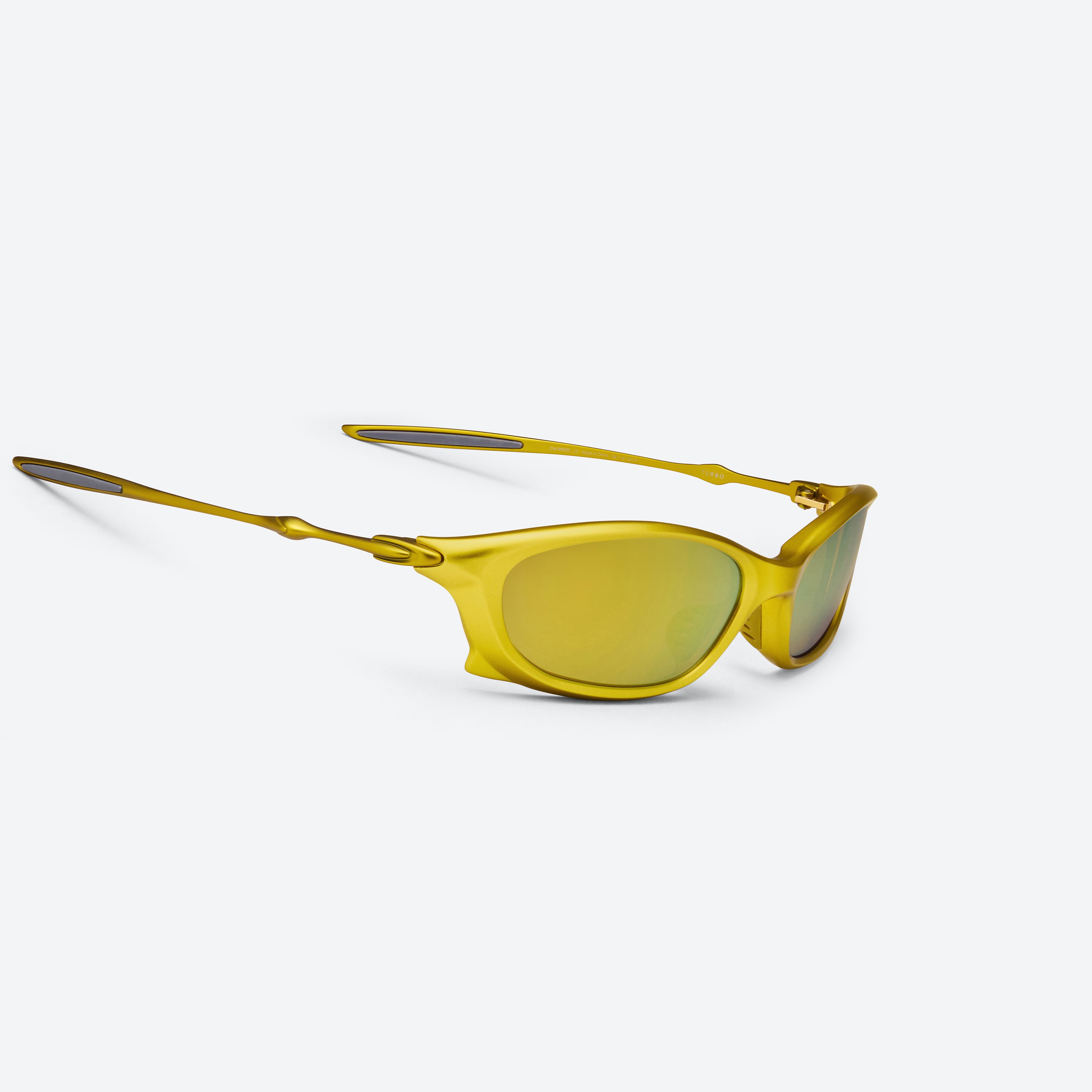 45-degree detailed view of Gentle Monster Turbo MGD3 Gold Mixed framed Wraparound sunglasses.