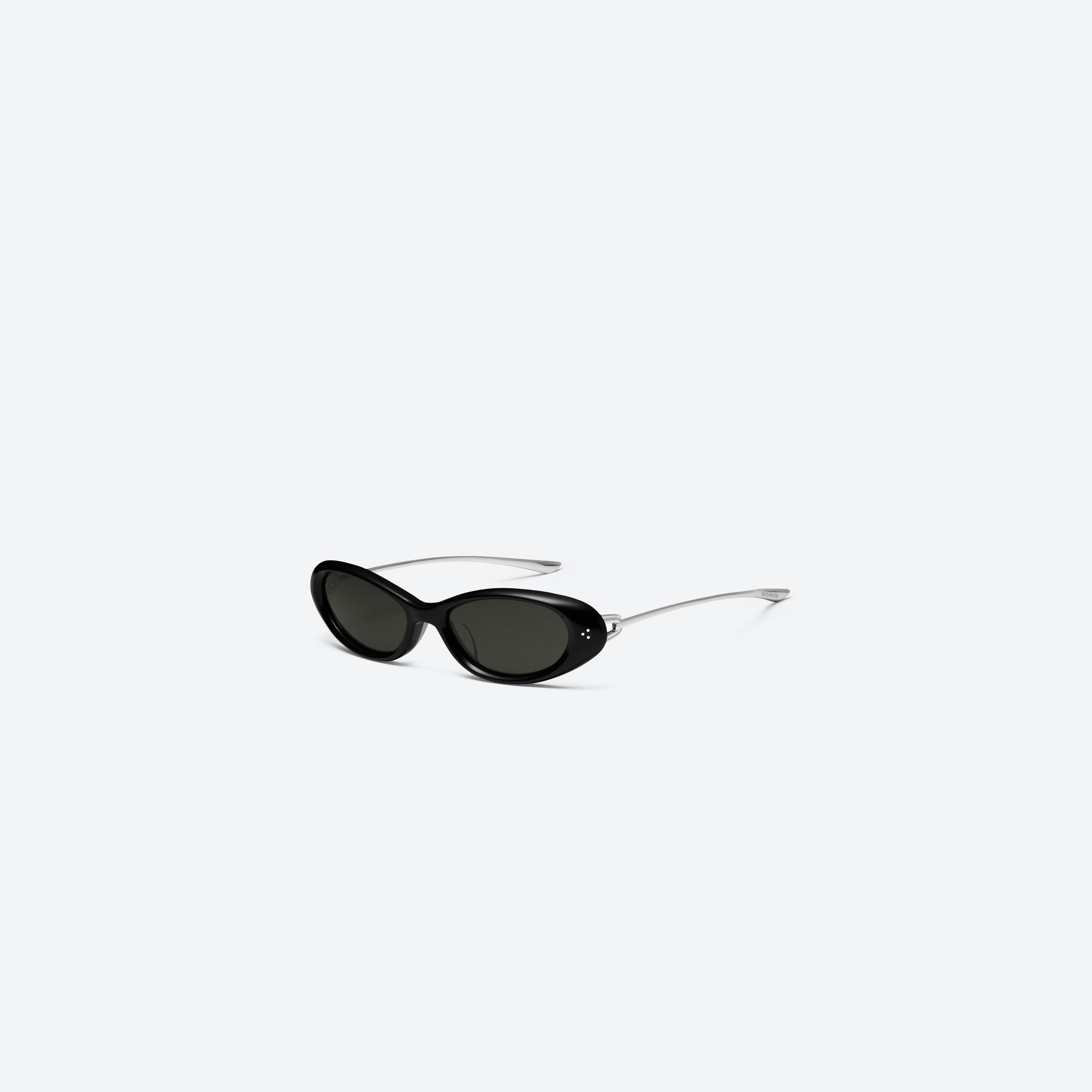 45-degree view of Gentle Monster Ora 01 Black Mixed framed Oval sunglasses.