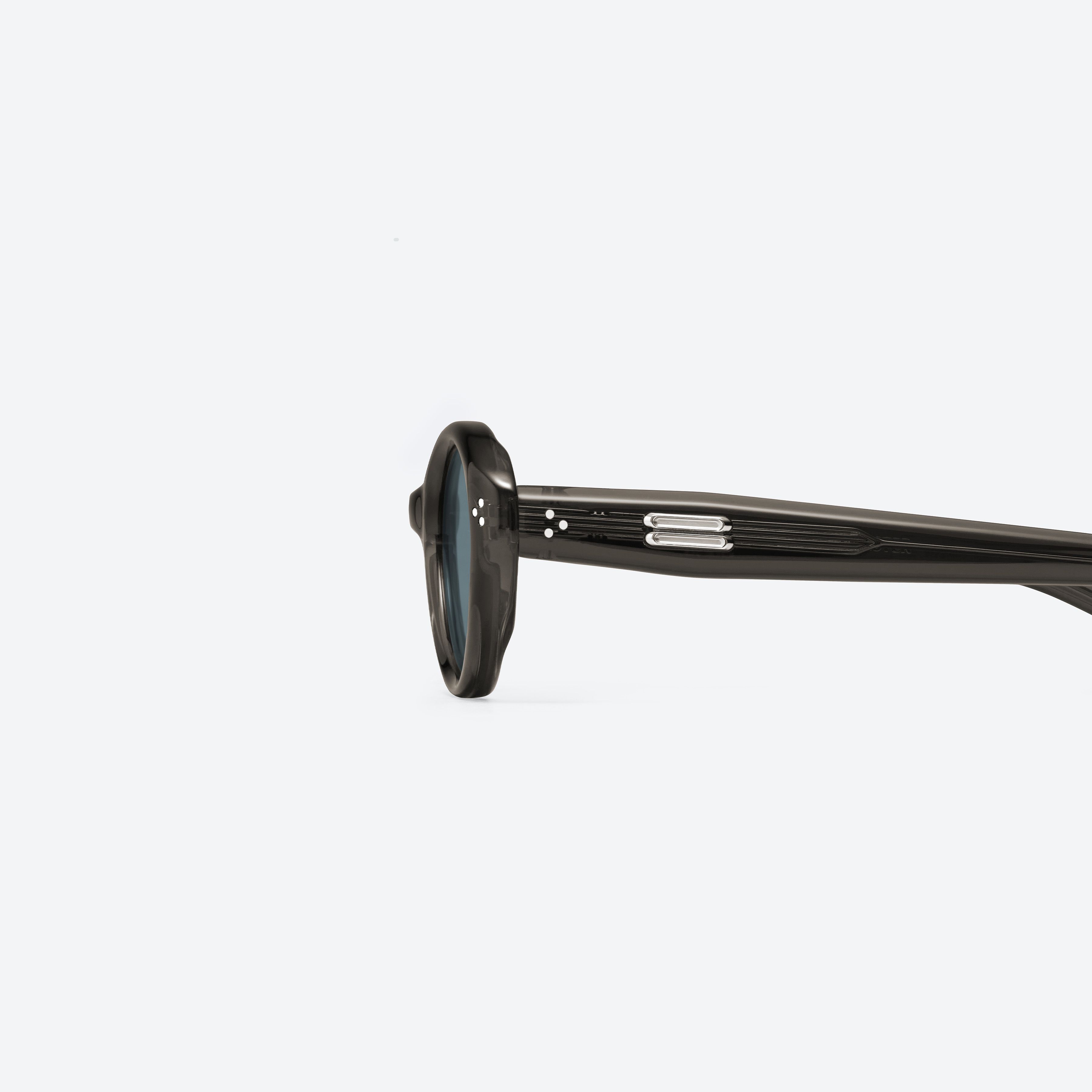 A detailed left view of Gentle Monster Cuscus BRC21 Brown Acetate framed Oval sunglasses.