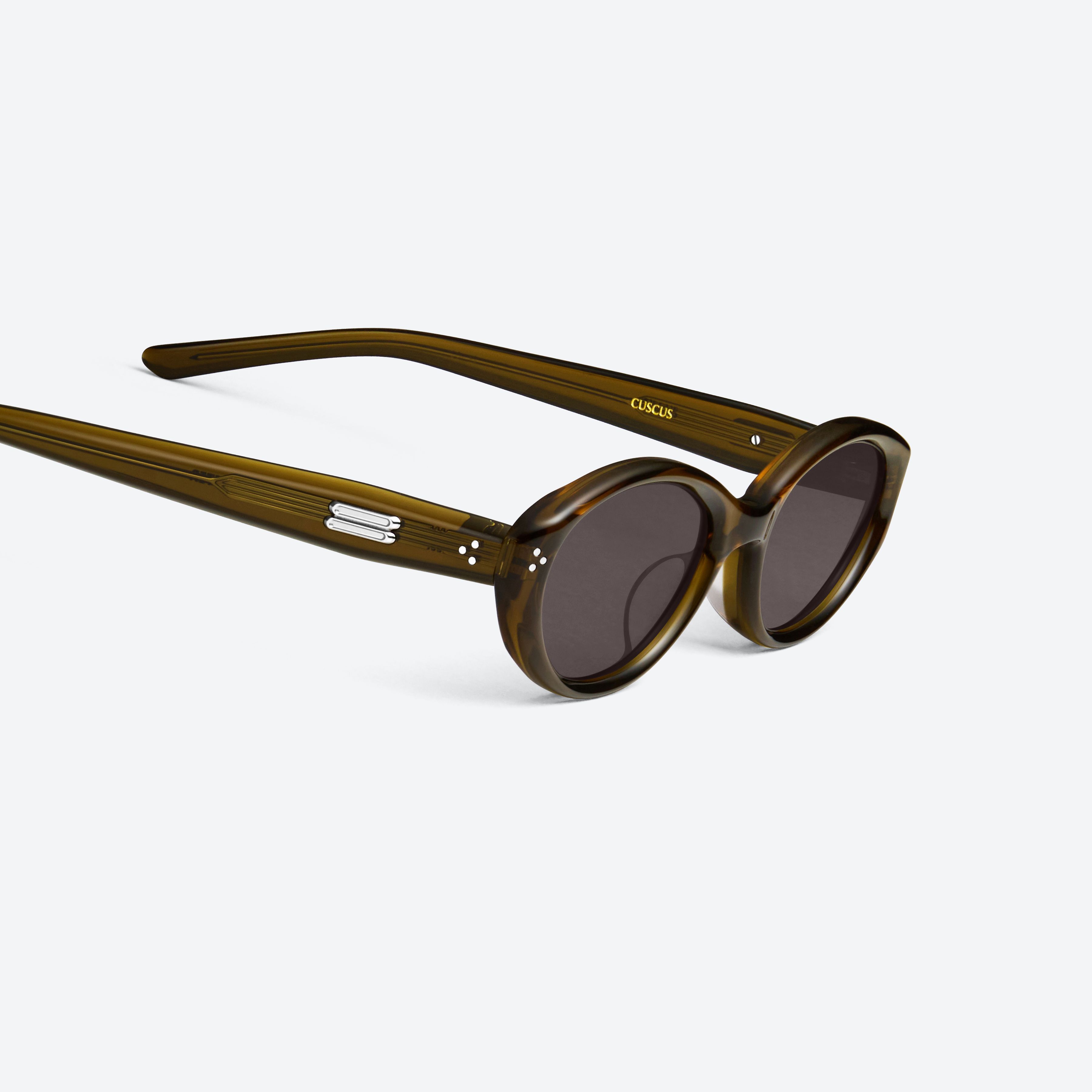 45-degree detailed view of Gentle Monster Cuscus BRC20 Brown Acetate framed Oval sunglasses.