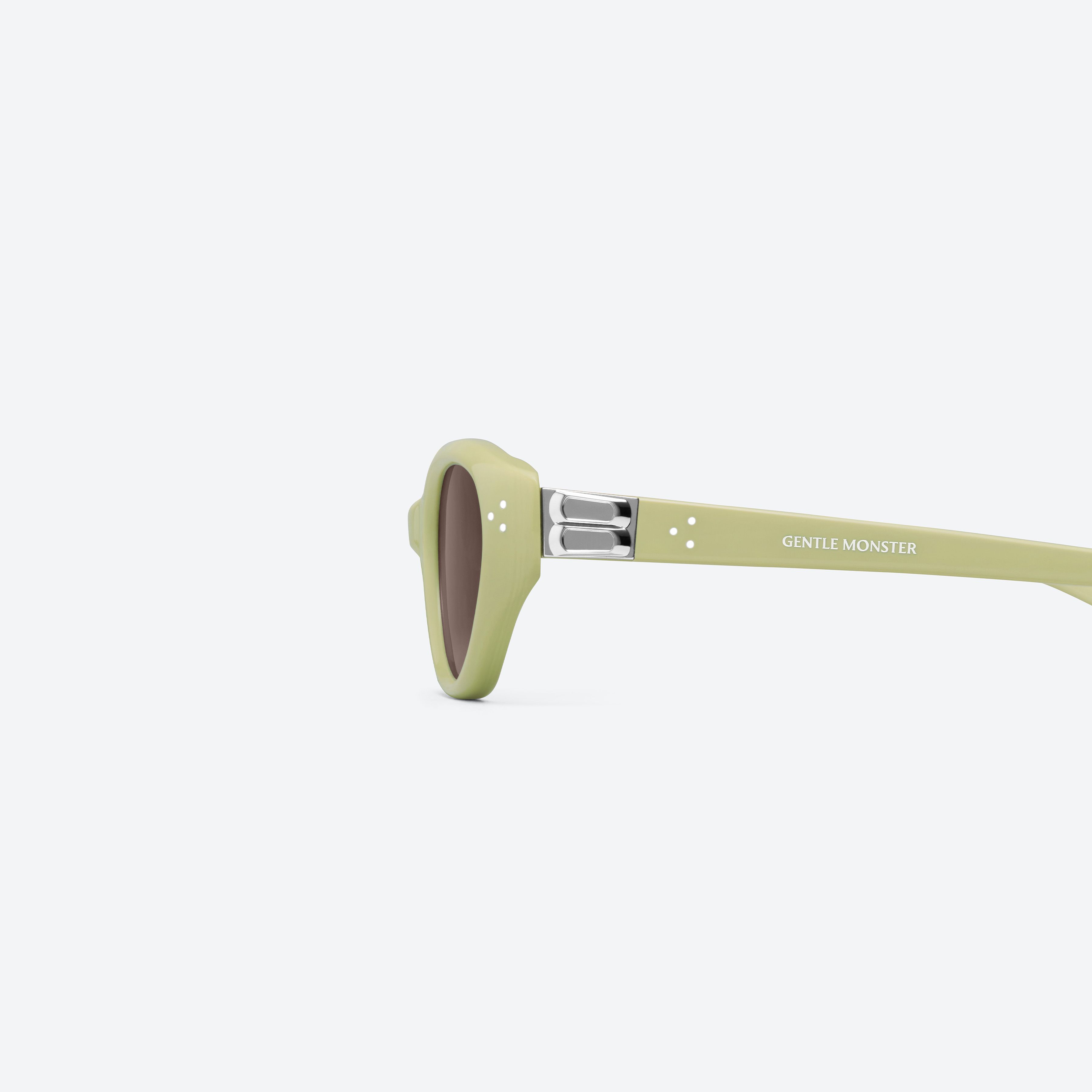 A detailed left view of Gentle Monster Vanilla GR9 Green Acetate framed Cat-eye sunglasses.