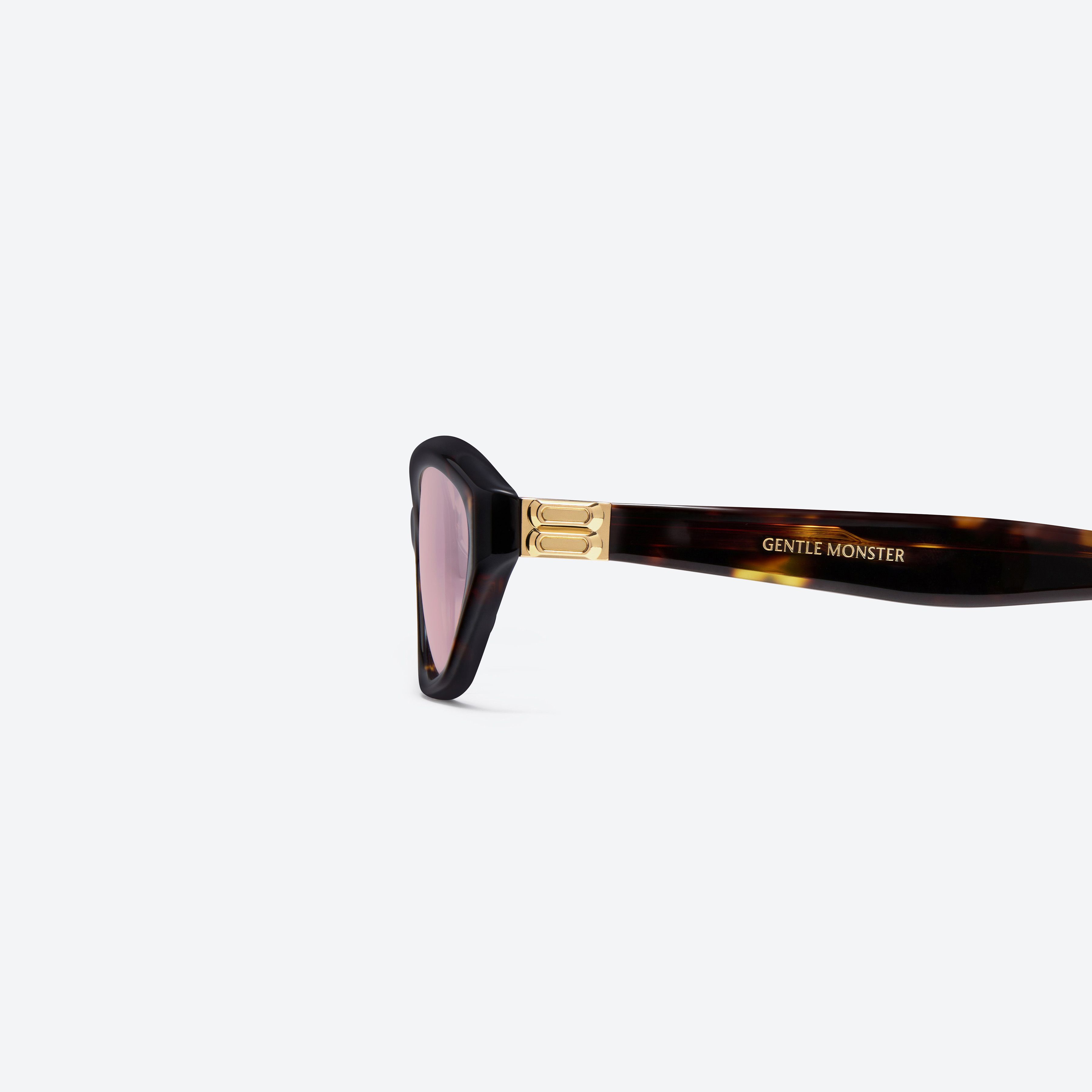 A detailed left view of Gentle Monster Lamda T9 Tortoise Acetate framed Cat-eye sunglasses.