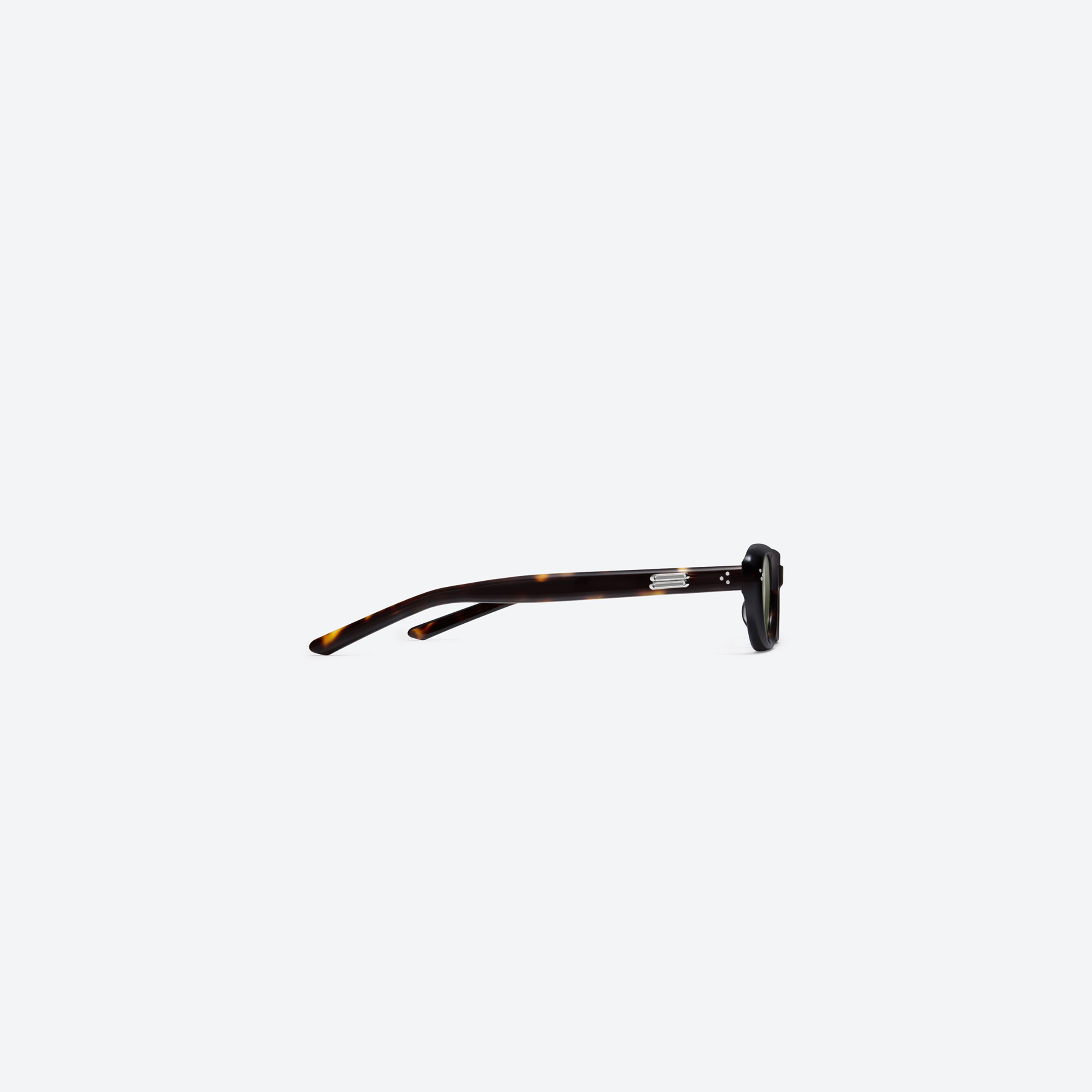 A detailed right view of Gentle Monster Madlenne T9 Tortoise Acetate framed Cat-eye sunglasses.