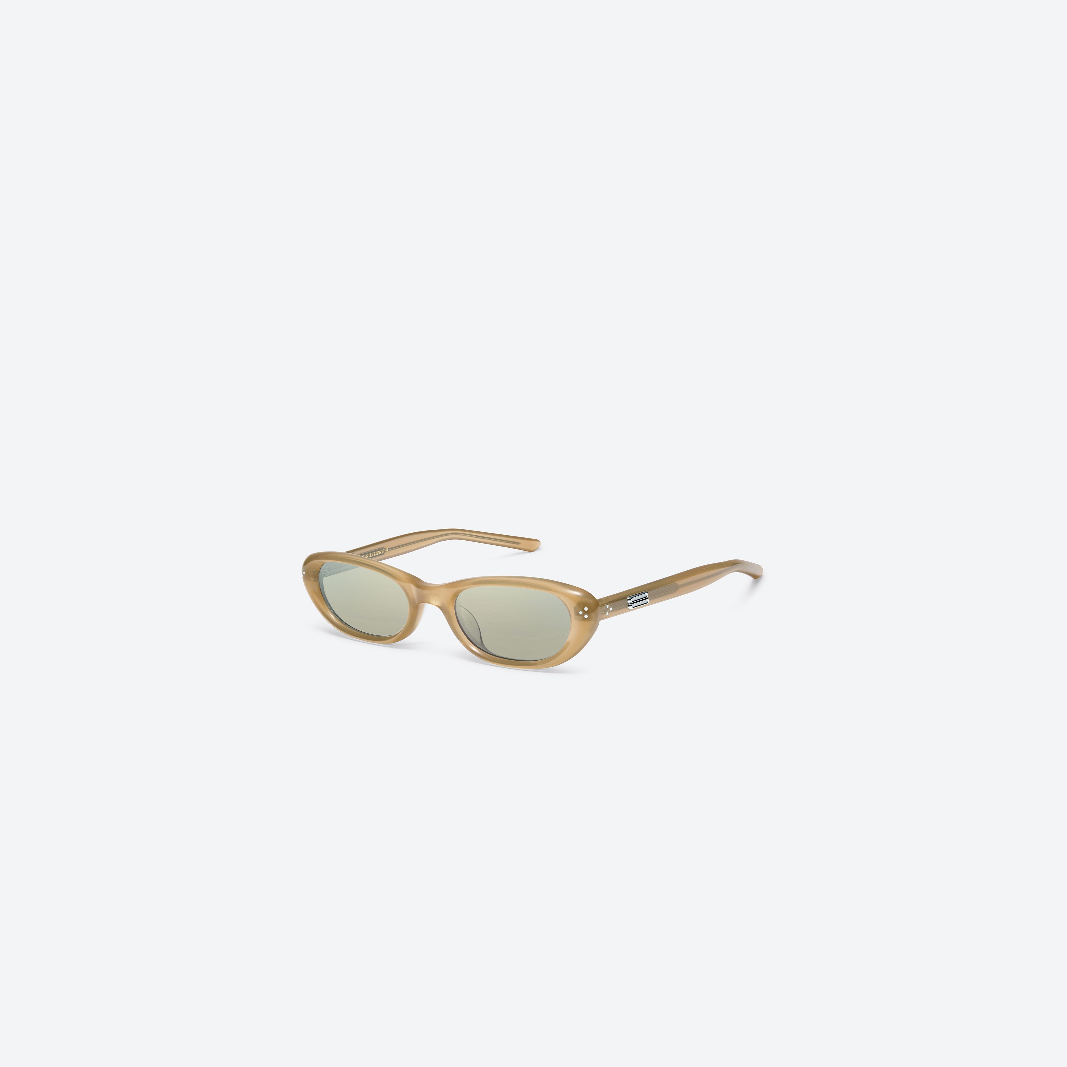 45-degree view of Gentle Monster Madlenne OC3 Orange Acetate framed Cat-eye sunglasses.