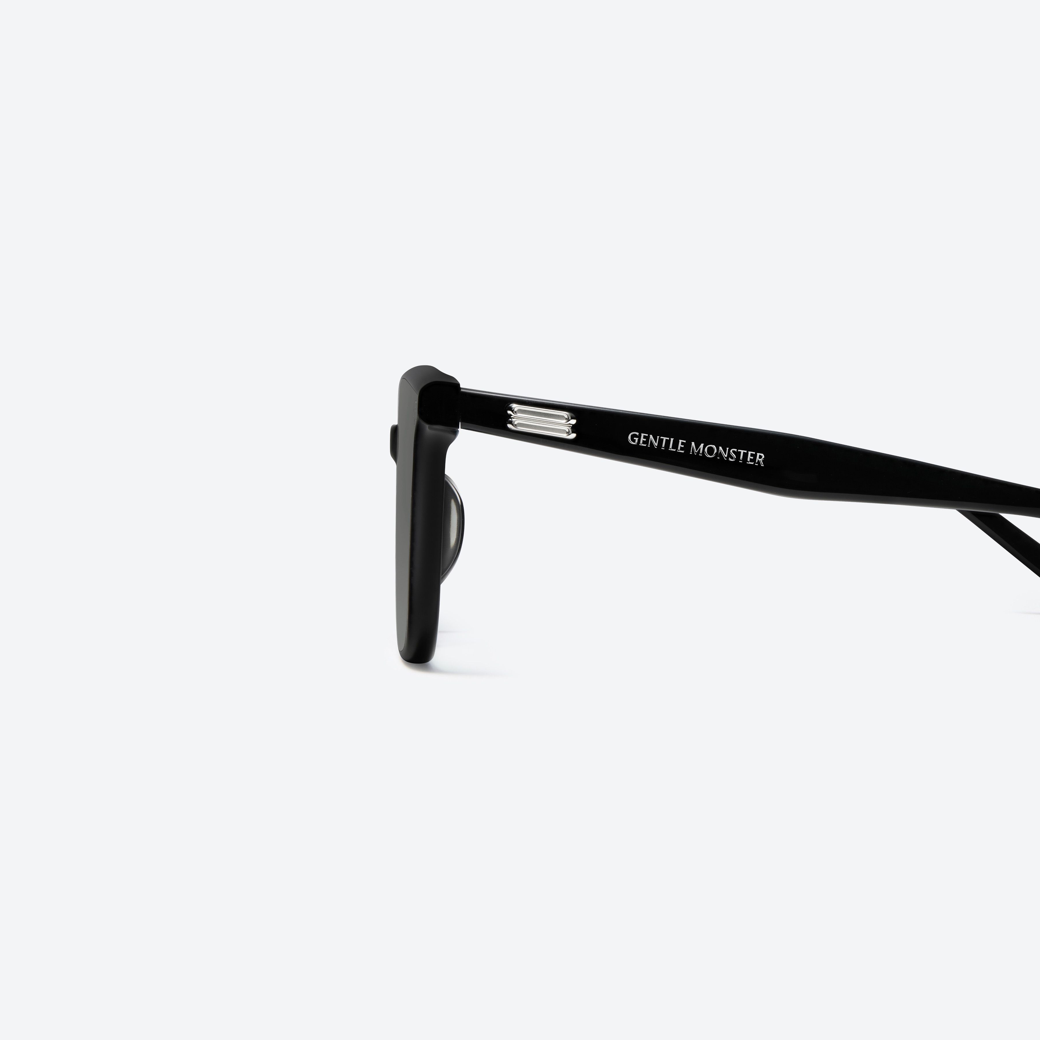 A detailed left view of Gentle Monster Lo Lou 01 Black Acetate framed Square sunglasses.