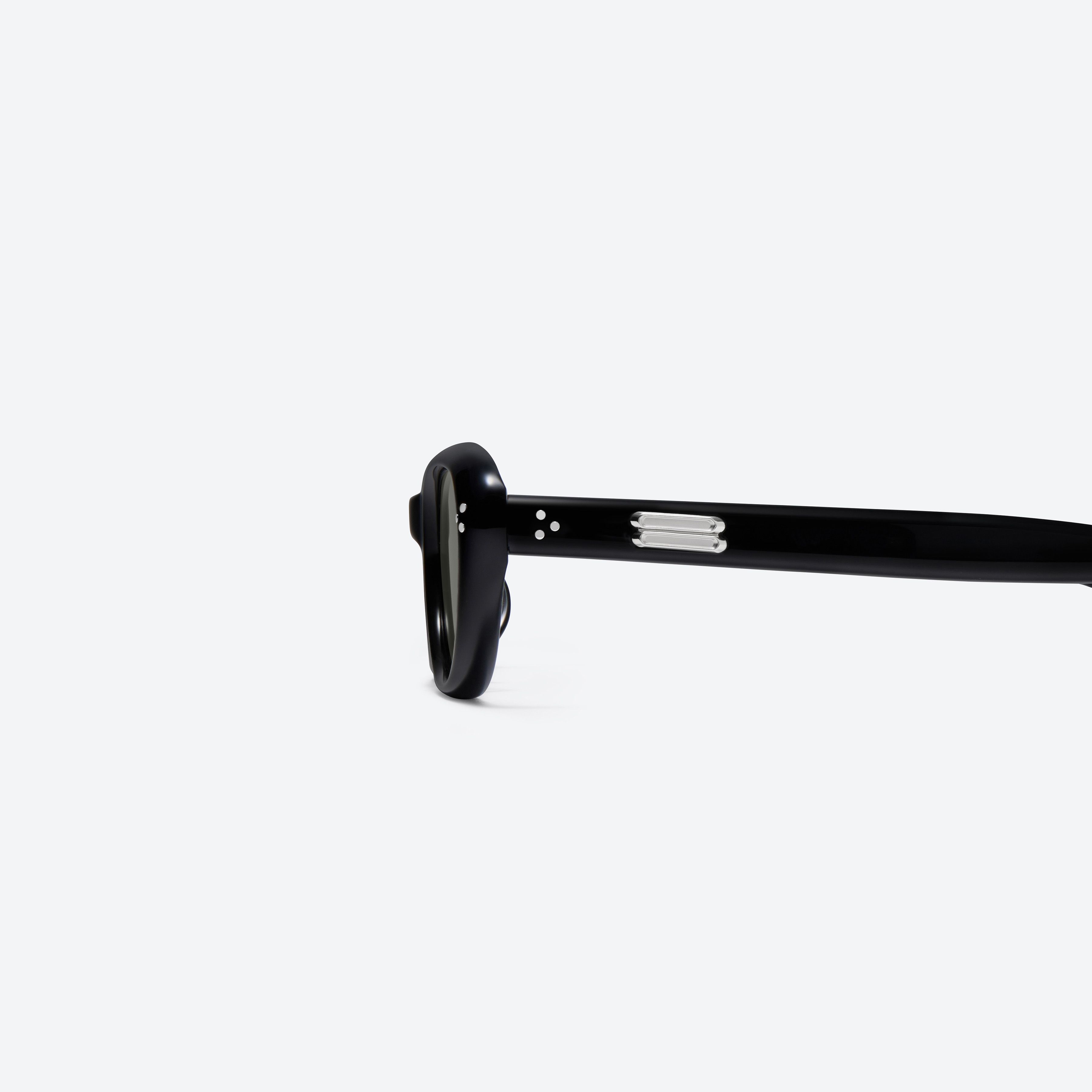 A detailed left view of Gentle Monster Madlenne 01 Black Acetate framed Cat-eye sunglasses.