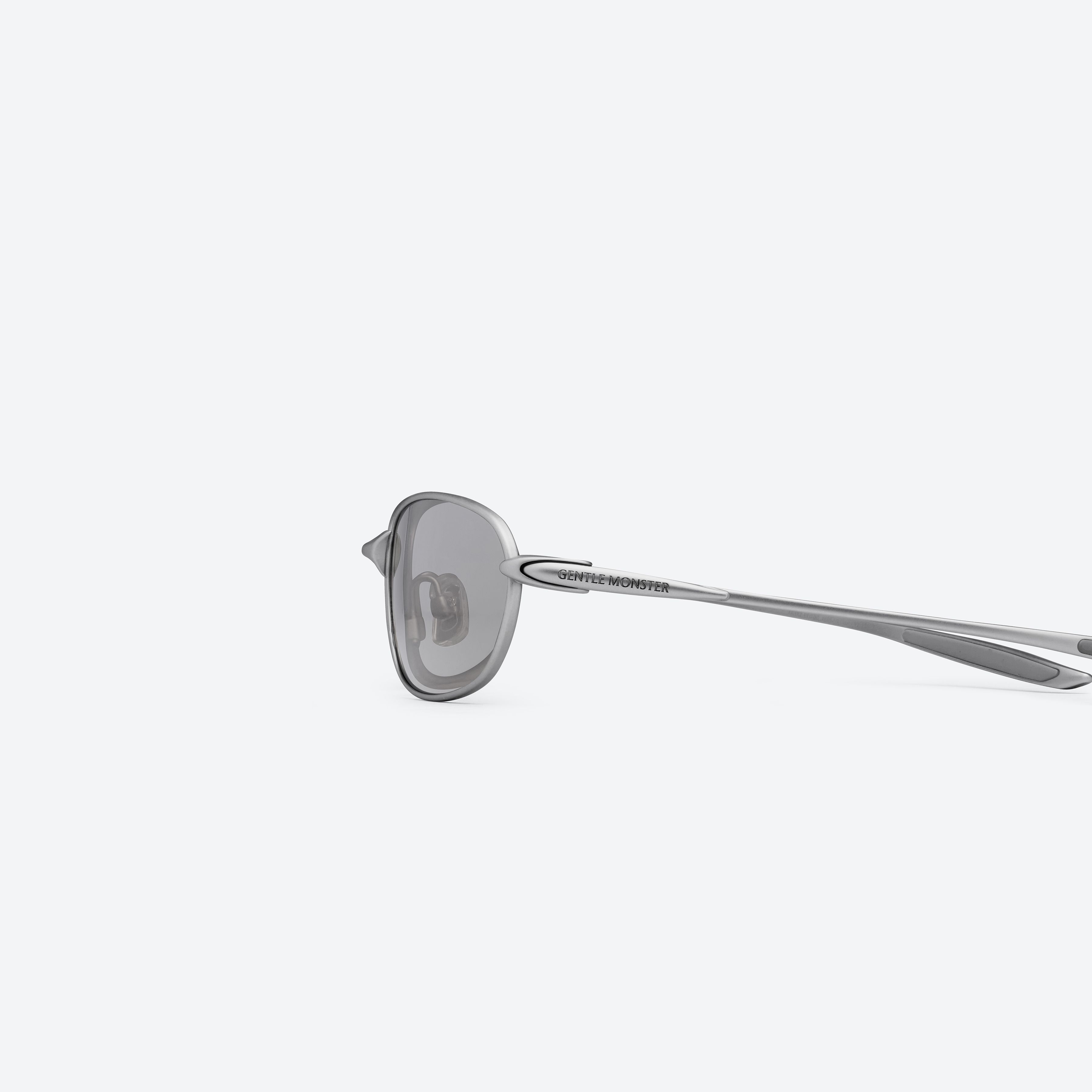 A detailed left view of Gentle Monster Pitot M021 Gray Metal framed Wraparound sunglasses.