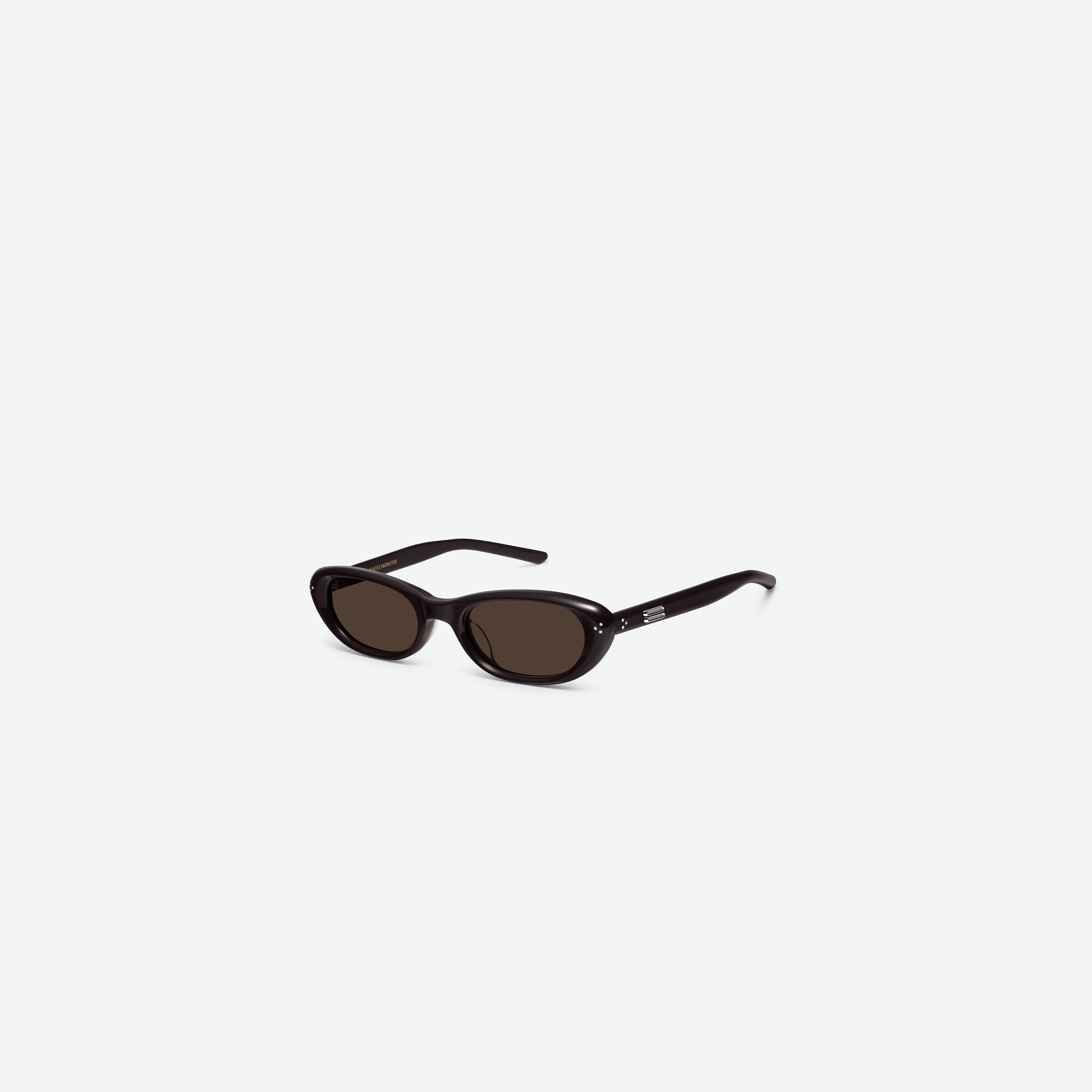 45-degree view of Gentle Monster Madlenne BR2 Brown Acetate framed Cat-eye sunglasses.