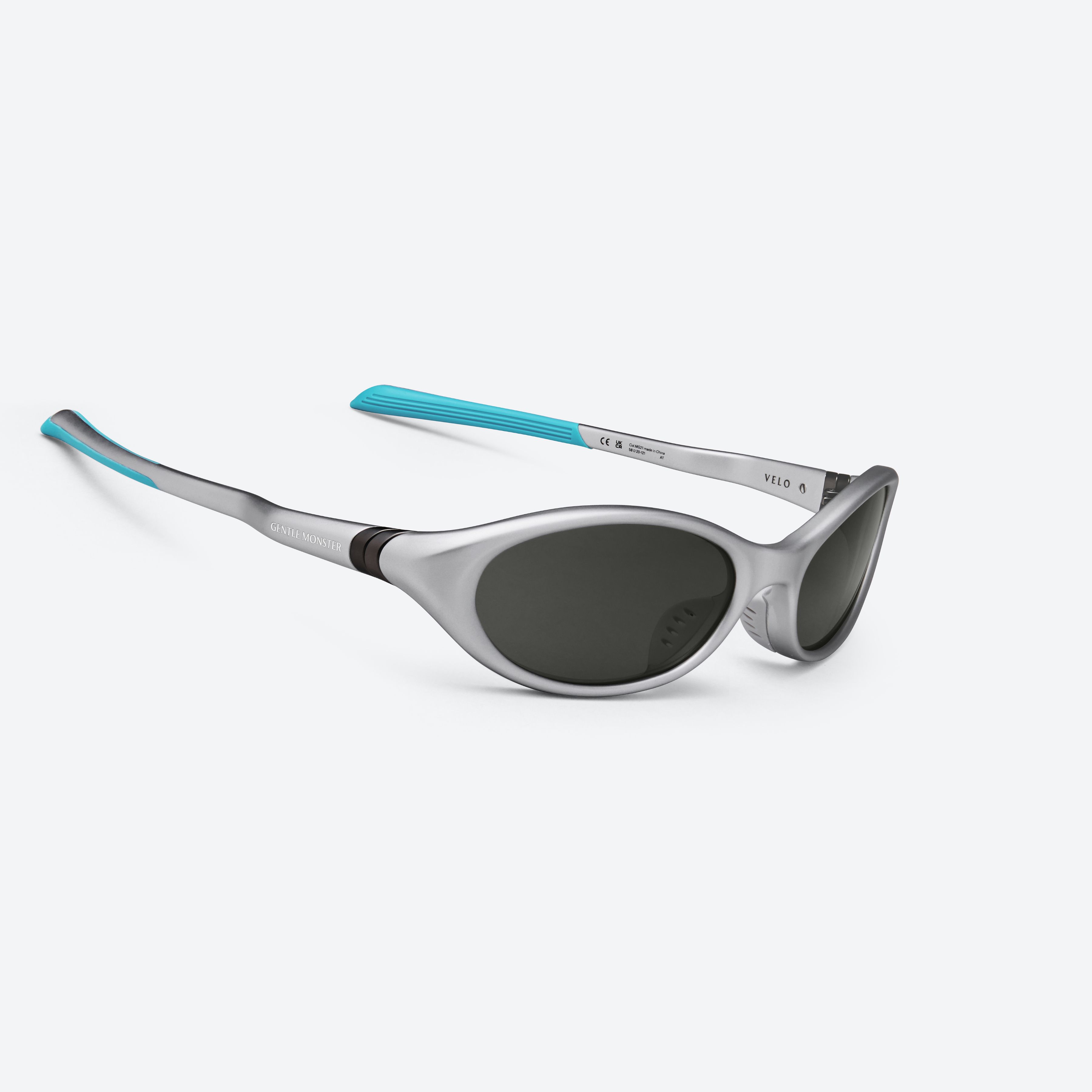 45-degree detailed view of Gentle Monster Disney F1 - Velo MG21 Gray Nylon framed Wraparound sunglasses.